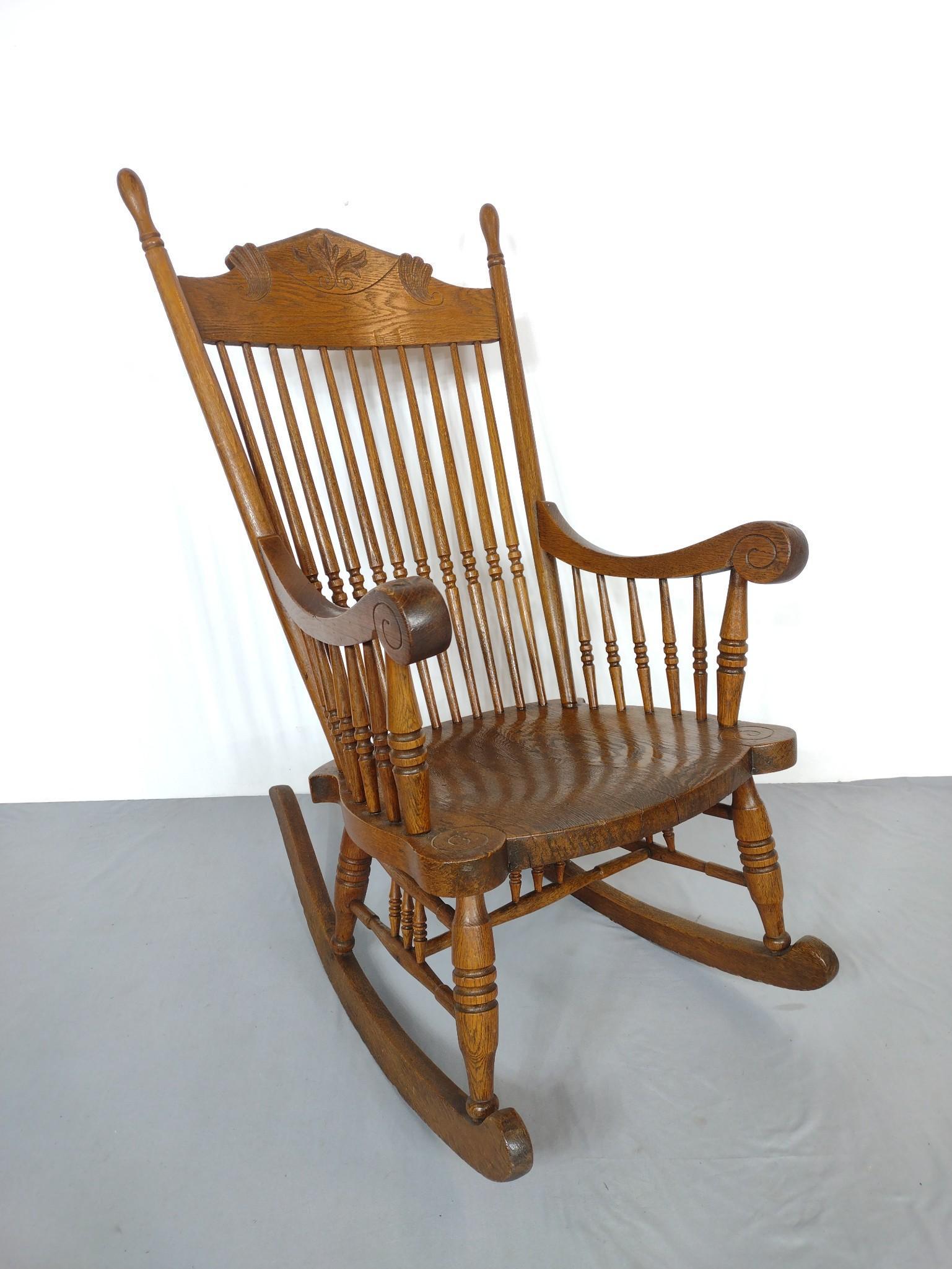 Pressed Back Rocker: 22" wide X 34-1/2" deep X 42-1/2" high. Has some discoloring. MG. IMPORTANT: Before bidding, please read the terms and conditions. When you registered for the auction you agreed to these terms and wil