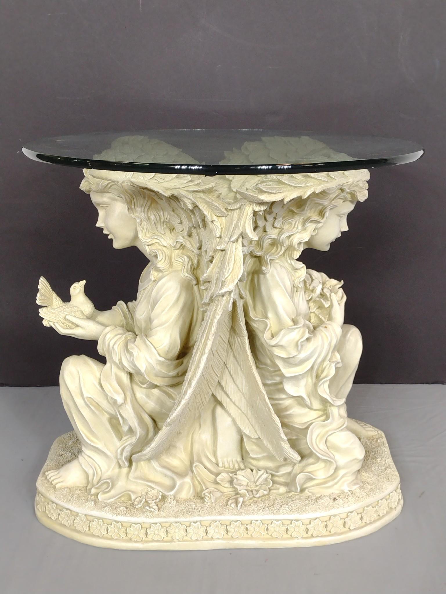 Resin Angel Table With Glass Top: 26" diameter X 24-1/2" high. No manufactures name found. MG. IMPORTANT: Before bidding, please read the terms and conditions. When you registered for the auction you agreed to these terms and will be 