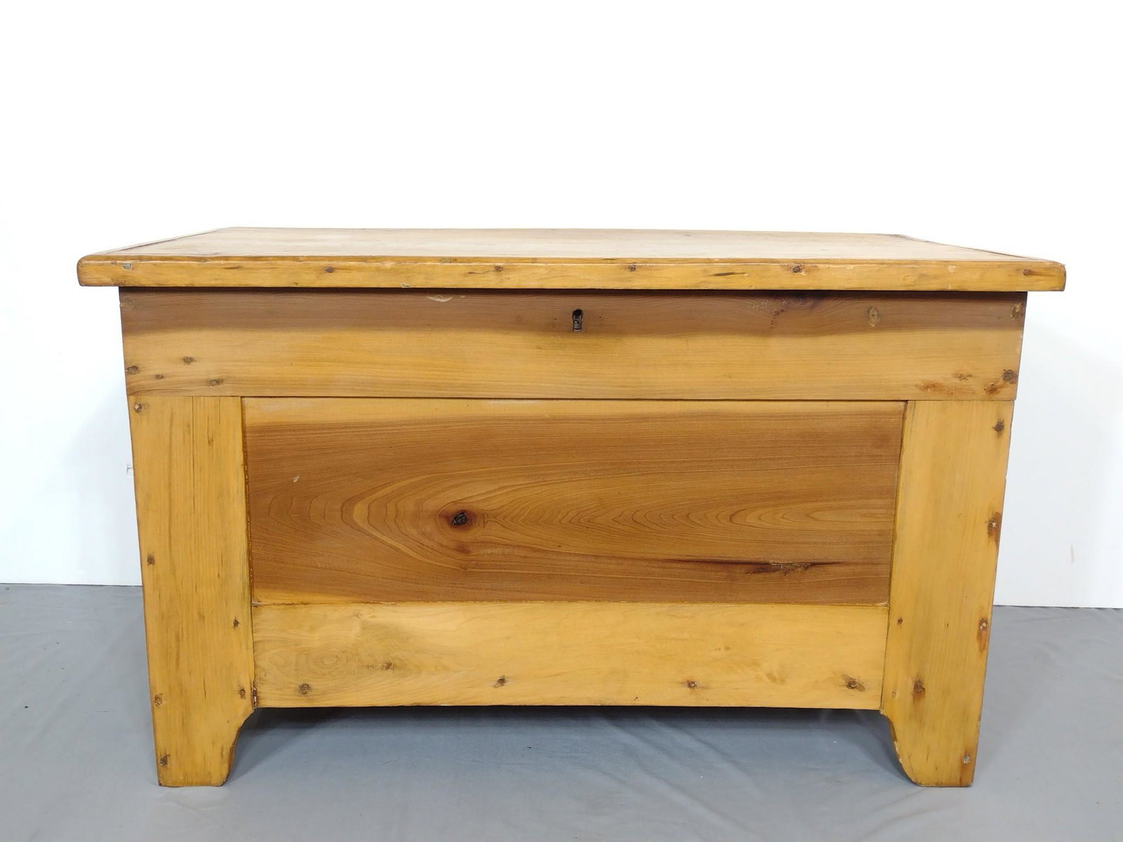 Blanket Chest: 38" wide X 18" deep X 23" high. Has some light scratches. MG. IMPORTANT: Before bidding, please read the terms and conditions. When you registered for the auction you agreed to these terms and will be