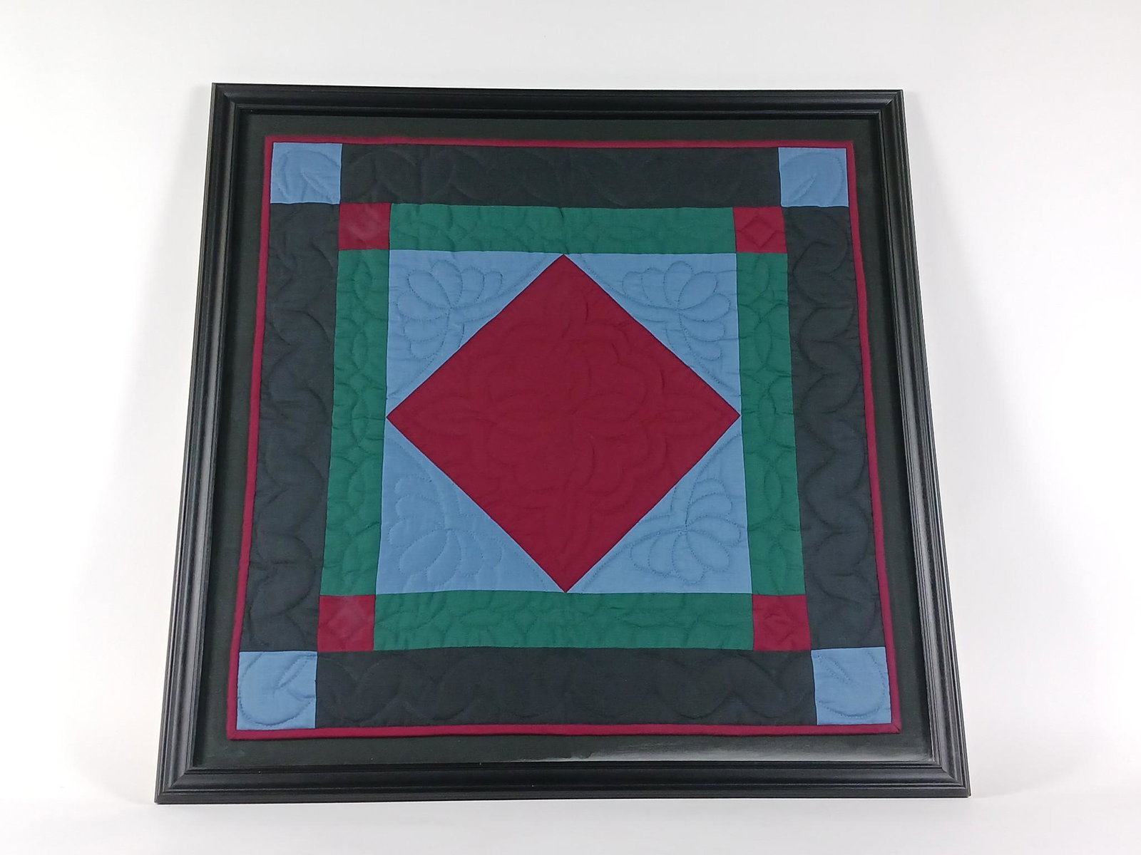 Amish Quilt Framed: Overall with frame 35-1/2" high x 35-1/2" wide. Discoloration at lower right. LR IMPORTANT: Before bidding, please read the terms and conditions. When you registered for the auction you agreed to thes