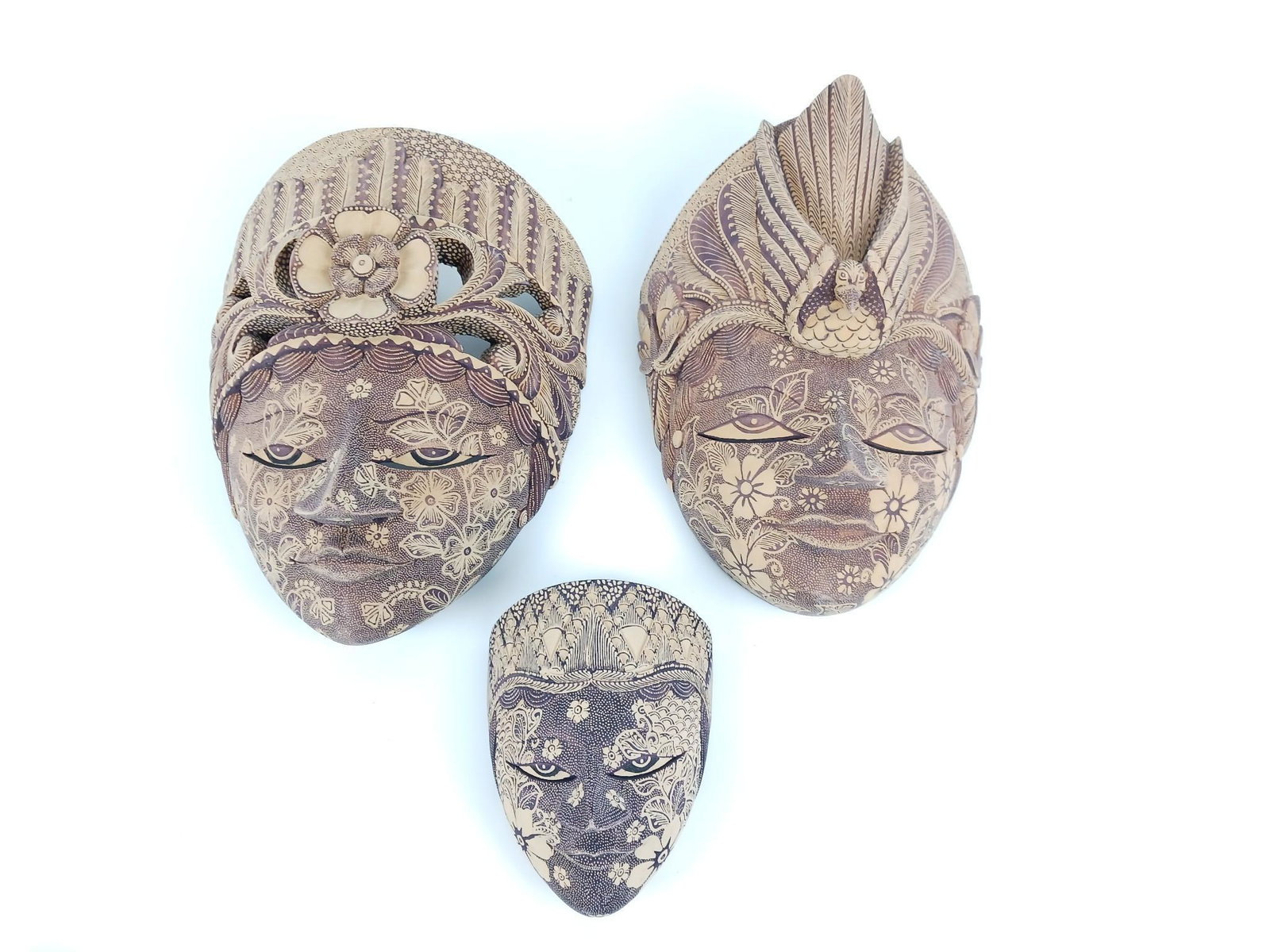 3 Balinese Wooden Masks: All unsigned. 5" to 9" wide x 6-1/2" to 11-1/4" high. LR IMPORTANT: Before bidding, please read the terms and conditions. When you registered for the auction you agreed to these terms and will be requ