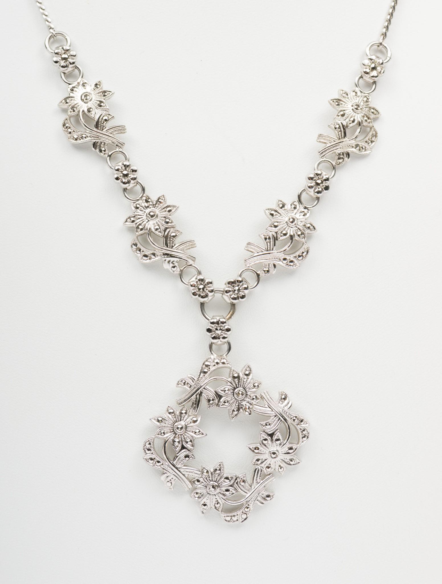 Sterling & Marcasite Necklace: Sterling and marcasite floral necklace. Stamped "Sterling, Fiegrio." 17" long with 1-1/2" pendant. EK IMPORTANT: Before bidding, please read the terms and conditions. When you registered for the aucti