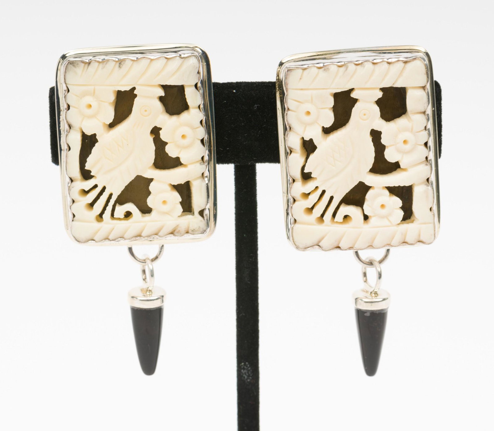 Gail Goldin Sterling Longevity Stone Modern Myths Earrings: Each with Chinese carved longevity stone with onyx drop. E253. Signed. 2-1/4" high. Gail Goldin began her career as a metal sculptor after earning an MA in metalsmithing in 1975, I the 80s she created