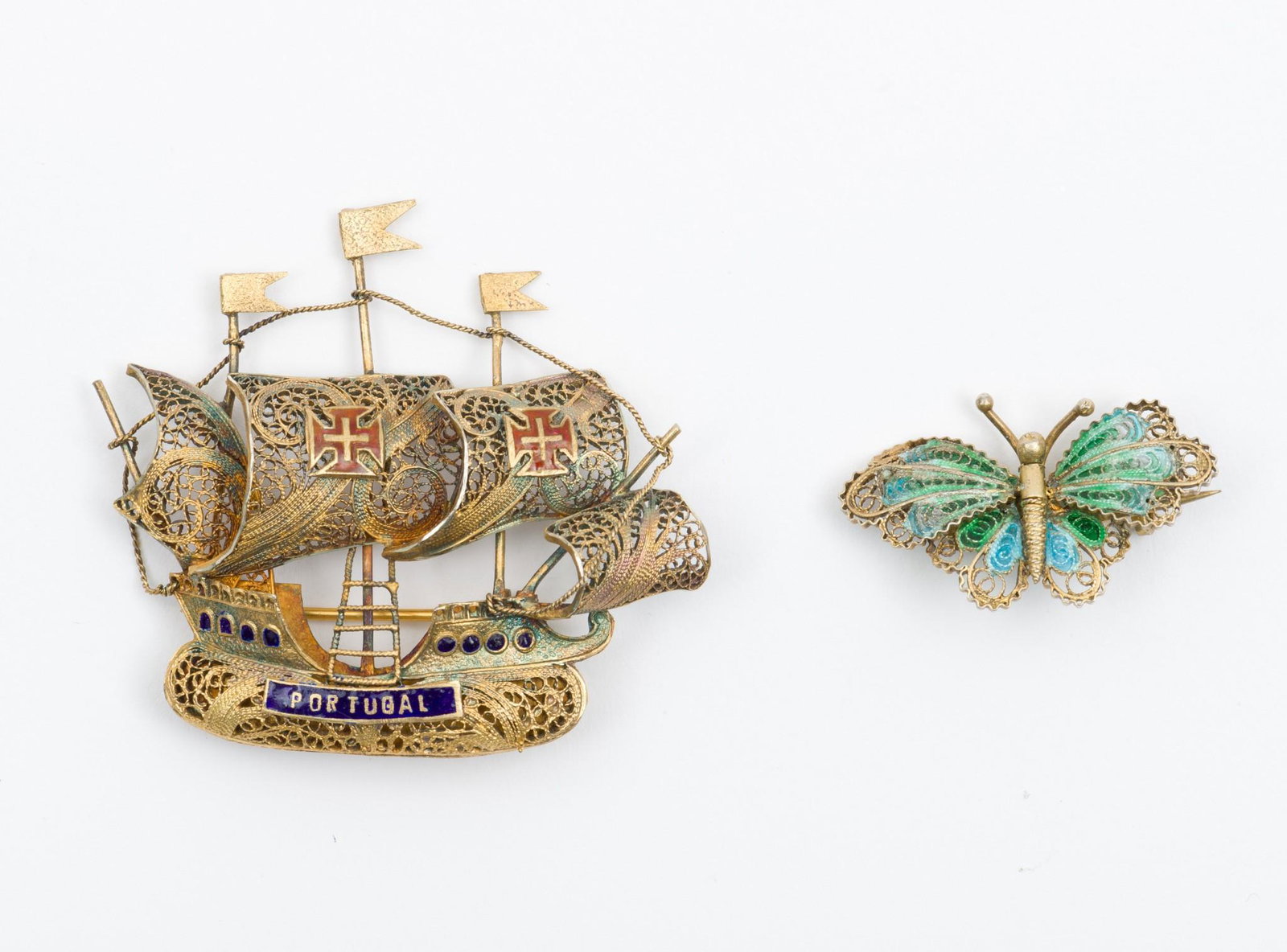 2 Silver Filigree Brooches: Including Portuguese ship, 2-1/2" x 2". Butterfly 1-3/8" wide. EK IMPORTANT: Before bidding, please read the terms and conditions. When you registered for the auction you agreed to these terms and wil