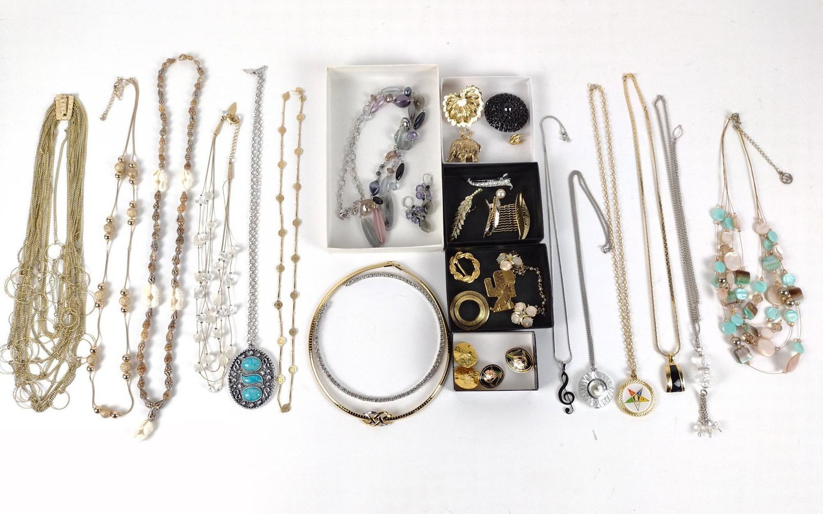 24 Pieces Costume Jewelry incl Monet and Lia Sophia: Necklaces, Earrings, brooches, scarf clip, and barrettes. Necklaces 20" long to 26" long. IMPORTANT: Before bidding, please read the terms and conditions. When you registered for the auction you agree