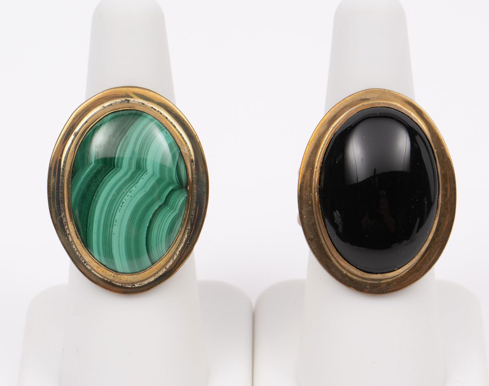 Two Gastineau Fashion Rings, Onyx and Malachite: Signed. Both size 6. 1-1/8" wide. MH. IMPORTANT: Before bidding, please read the terms and conditions. When you registered for the auction you agreed to these terms and will be required to comply with