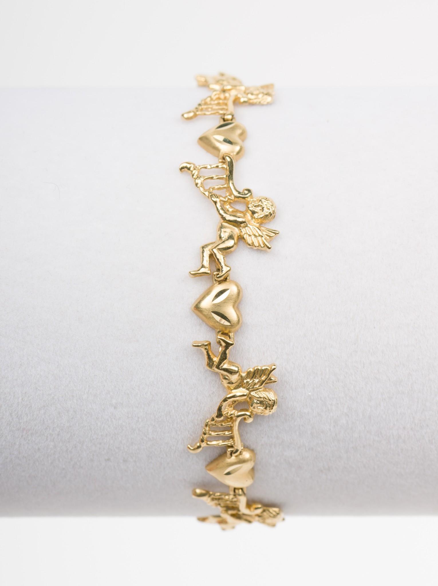 14K Gold Musical Angel Bracelet: Links of angels with harps and hearts. 6.2 dwt. 7-1/2" long. EK IMPORTANT: Before bidding, please read the terms and conditions. When you registered for the auction you agreed to these terms and will