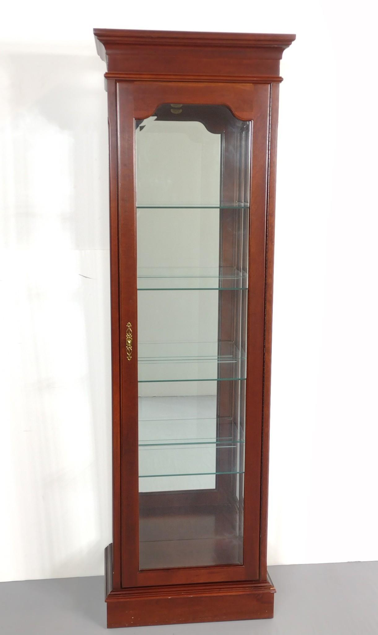 Jasper Cabinet Co. Lighted Curio: 23-1/4" wide X 14" deep X 74-1/2" high. Has some light scratches. MG. IMPORTANT: Before bidding, please read the terms and conditions. When you registered for the auction you agreed to these terms and