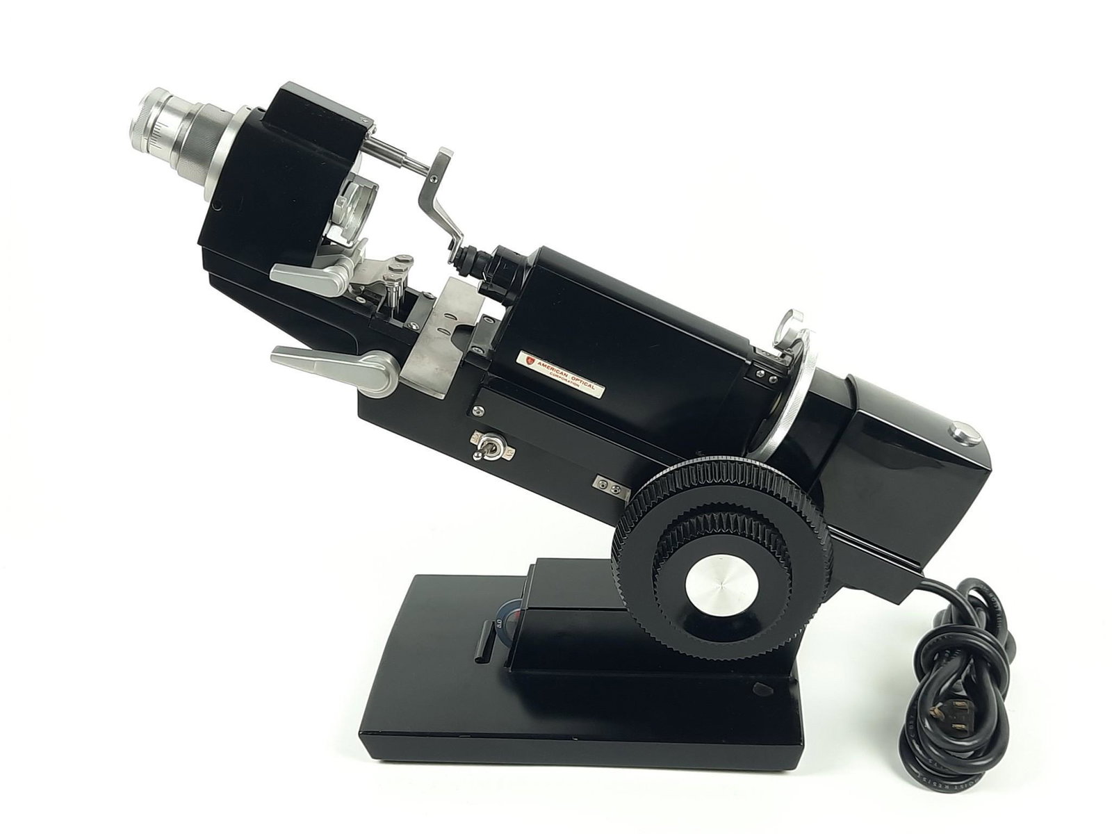 American Optical Macro Lensometer: Powers on. Model number 12603. 19" long x 13" to 17" high. LR IMPORTANT: Before bidding, please read the terms and conditions. When you registered for the auction you agreed to these terms and will be