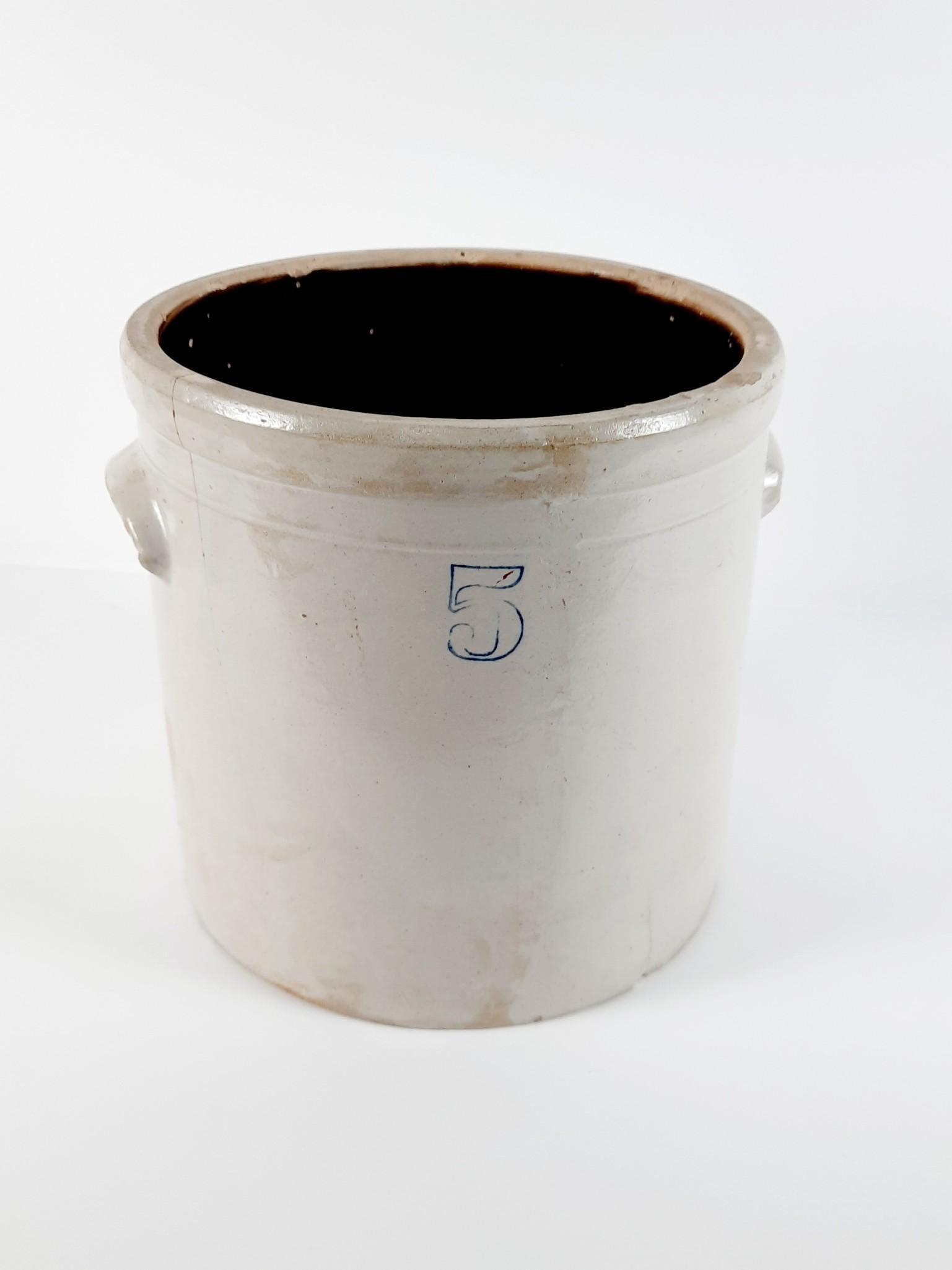 5 Gallon Stoneware Crock and Wine Corks: Crock unmarked. 14" diameter x 12-1/2" high. Cracks and losses to crock. LR IMPORTANT: Before bidding, please read the terms and conditions. When you registered for the auction you agreed to these ter