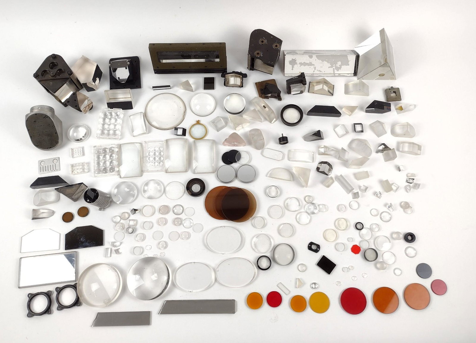 Large Group of Prisms & Lenses: 3/4" to 6-1/2" wide. MEG IMPORTANT: Before bidding, please read the terms and conditions. When you registered for the auction you agreed to these terms and will be required to comply with them.