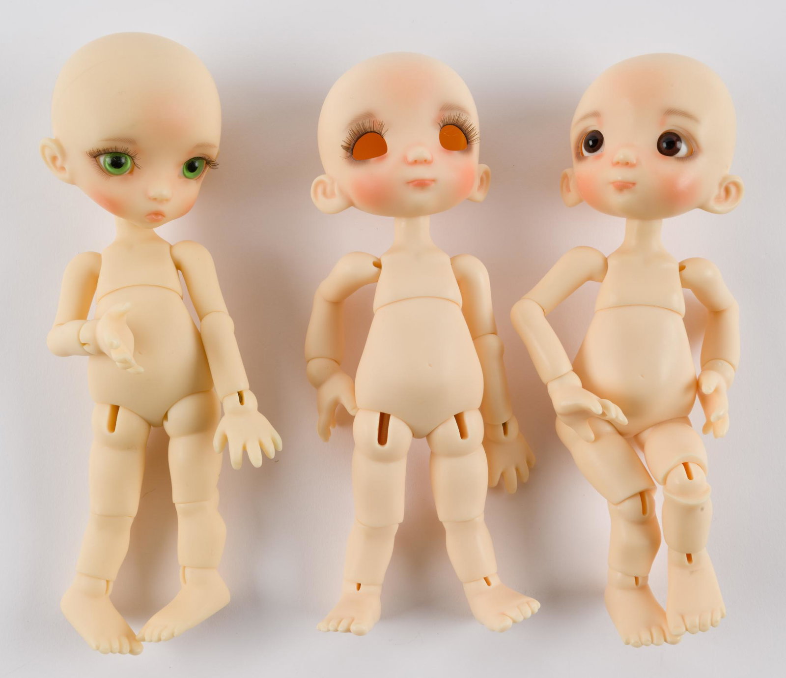 3 Linda Macario Dolls: All face up, two with eyes. 8" IMPORTANT: Before bidding, please read the terms and conditions. When you registered for the auction you agreed to these terms and will be required to comply with them.