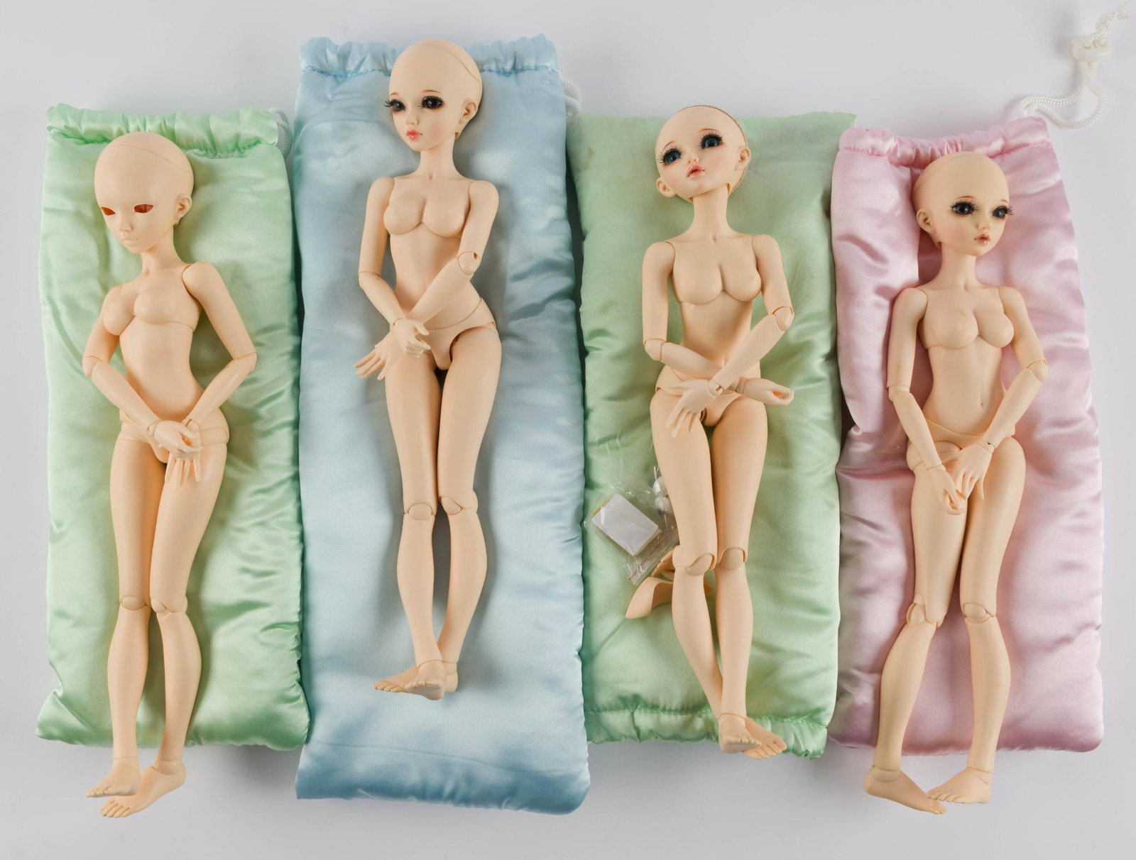 4 - 14" Chloe Dolls: 3 face up. LR IMPORTANT: Before bidding, please read the terms and conditions. When you registered for the auction you agreed to these terms and will be required to comply with them.