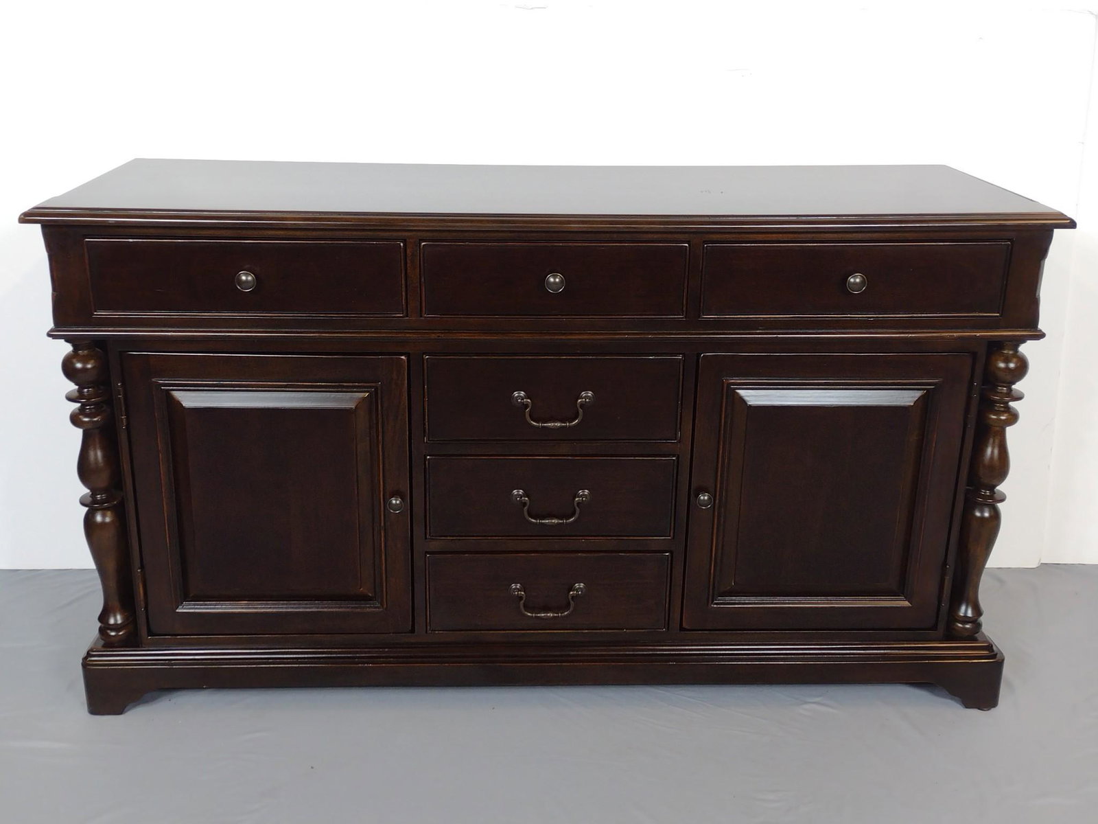Paula Deen Home Media Cabinet: 66" wide X 22" deep X 36" high. Top has some scratches. IMPORTANT: Before bidding, please read the terms and conditions. When you registered for the auction you agreed to these terms and will be requi