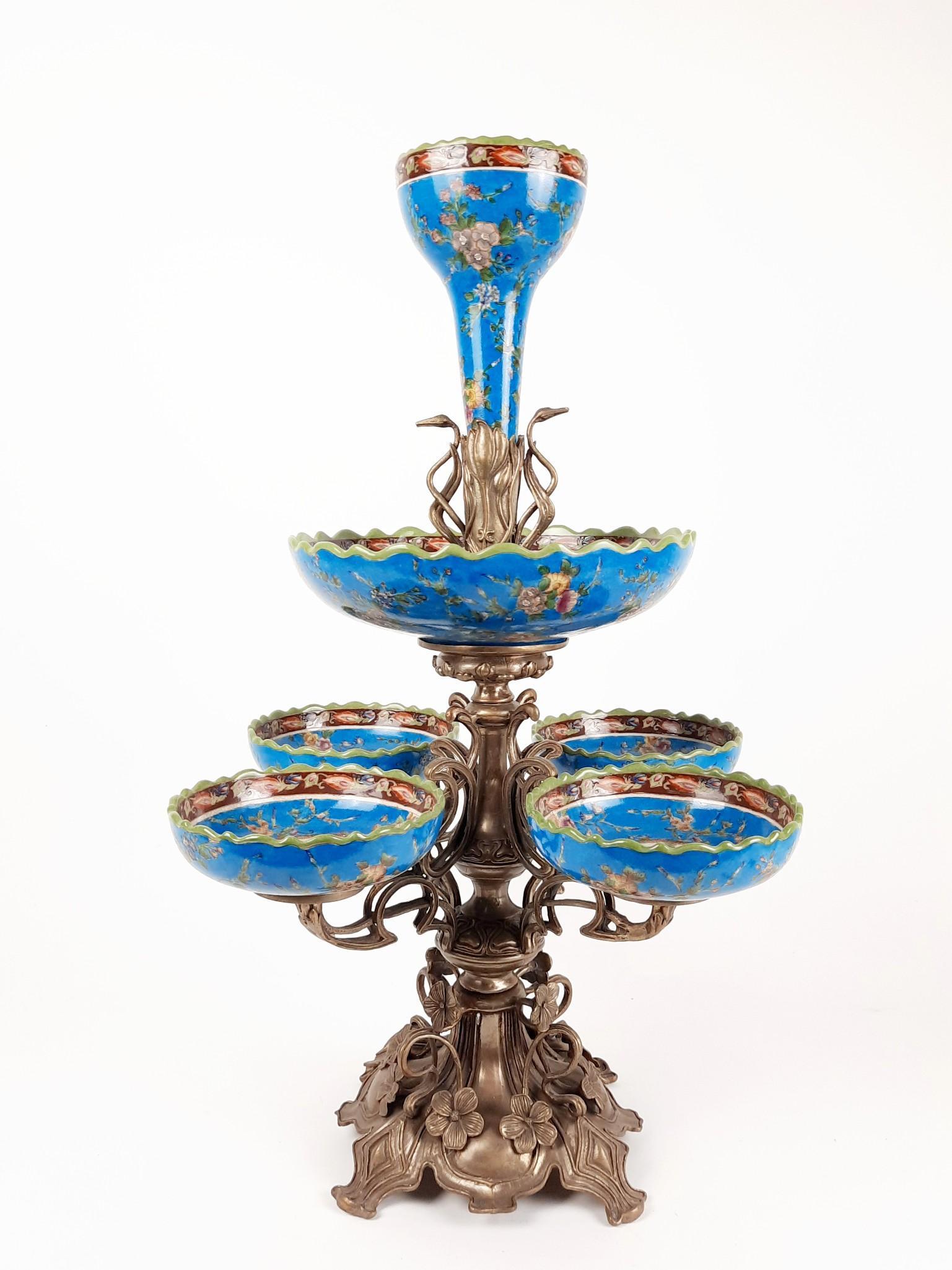 26" Floral Bronze and Porcelain Epergne: Unmarked. 14-1/2" wide x 14-1/2" deep x 26" high. LR IMPORTANT: Before bidding, please read the terms and conditions. When you registered for the auction you agreed to these terms and will be required