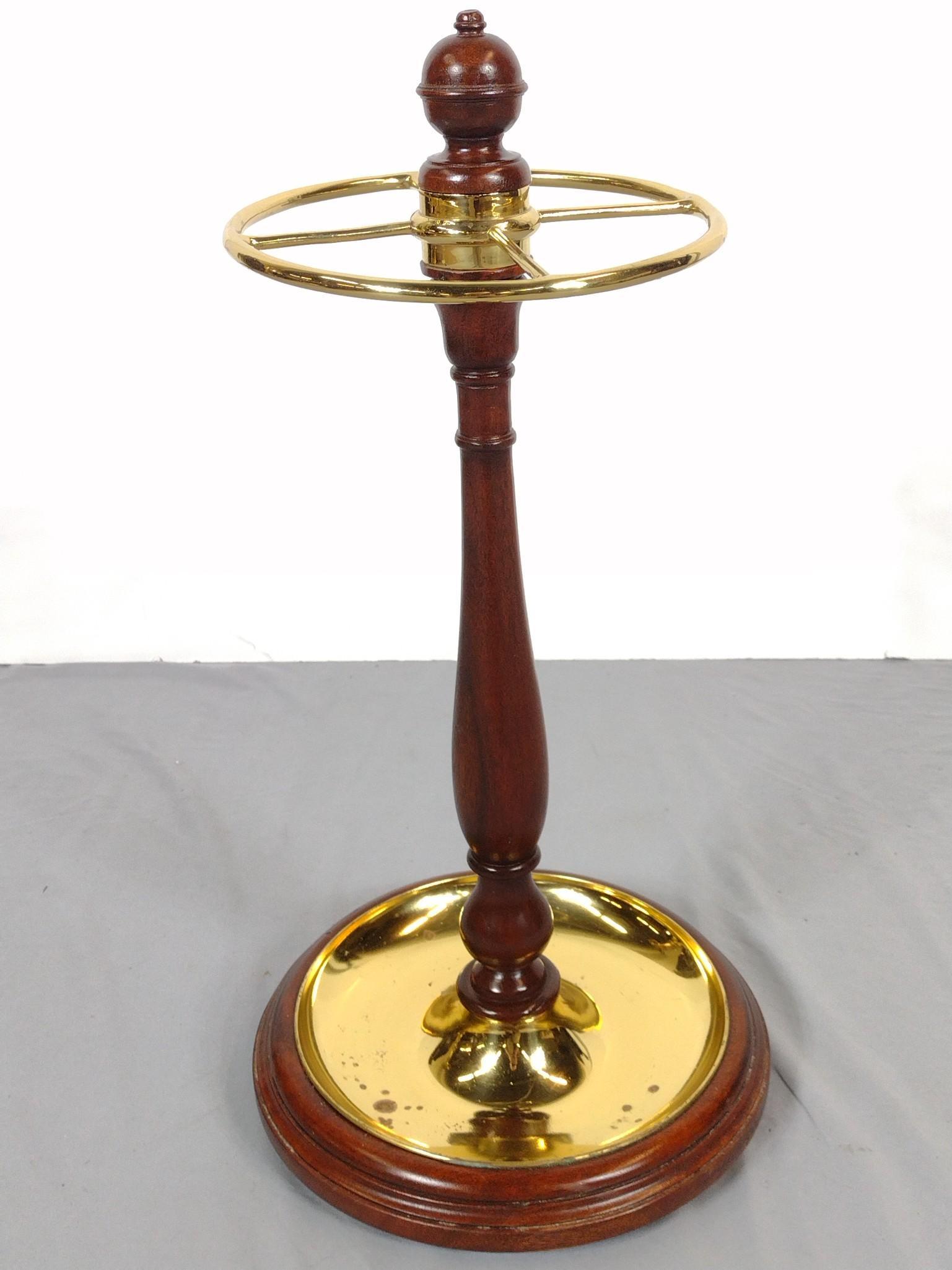 Wood & Brass Umbrella Stand: 12" diameter X 22" high. Brass has some discoloring. Missing one foot. No manufactures name found. MG. IMPORTANT: Before bidding, please read the terms and conditions. When you registered for the auct