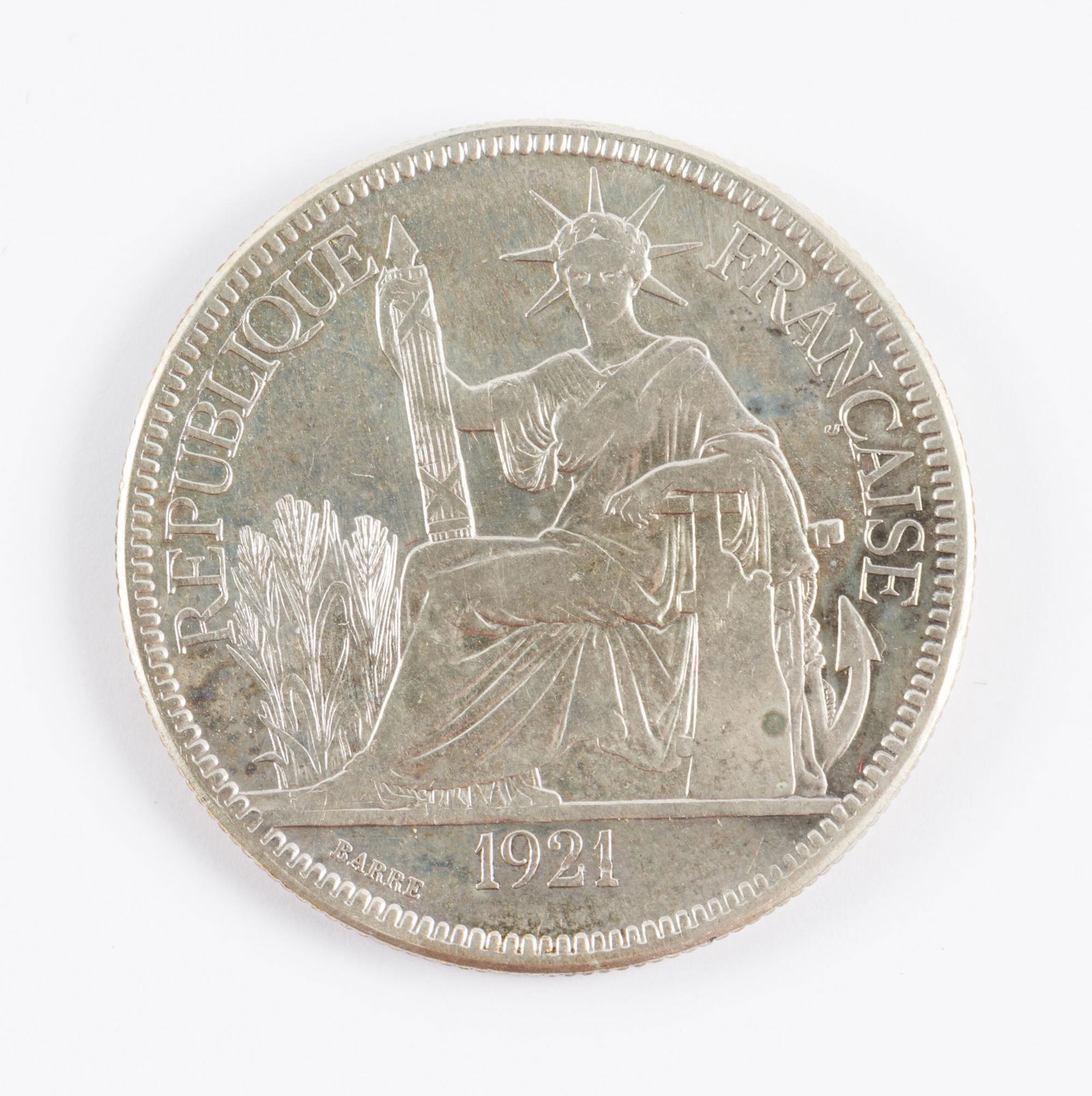 1921 French Indo-China Piastre De Commerce: 1921. Colonial Indo-China coinage. AJ IMPORTANT: Before bidding, please read the terms and conditions. When you registered for the auction you agreed to these terms and will be required to comply