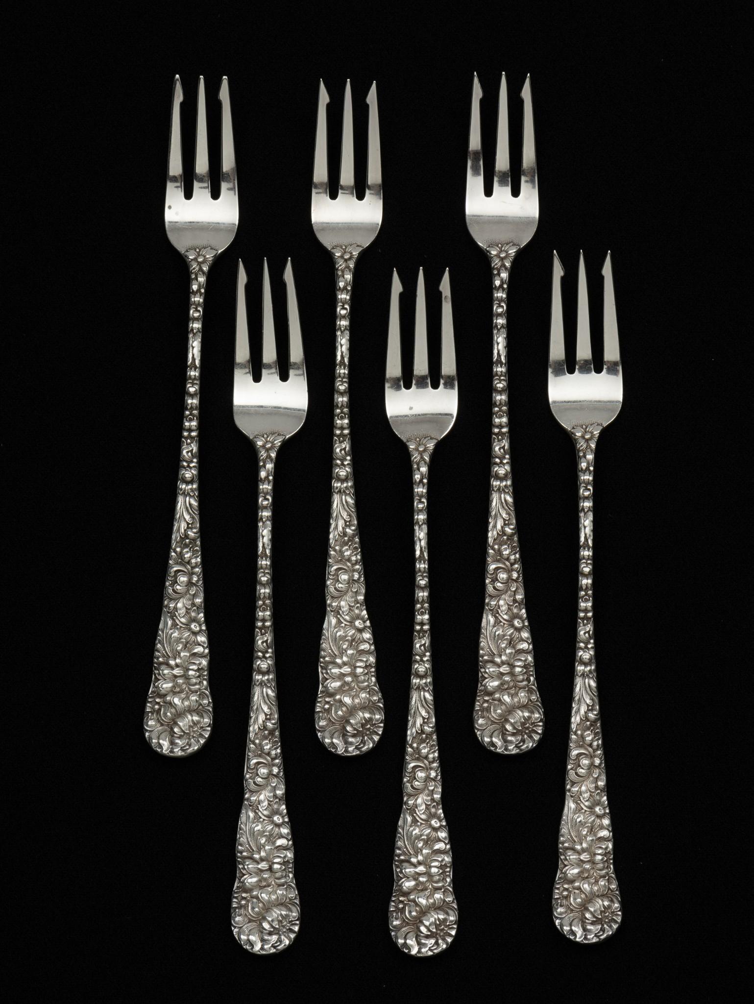 6 Monogrammed Stieff Repousse Cocktail Forks: Marked Stieff Sterling. Monogrammed "D" to back. Each 5-3/4" long. 4.6 total ozt. Light surface scratches as expected with careful use. DP. IMPORTANT: Before bidding, please read the terms and conditi