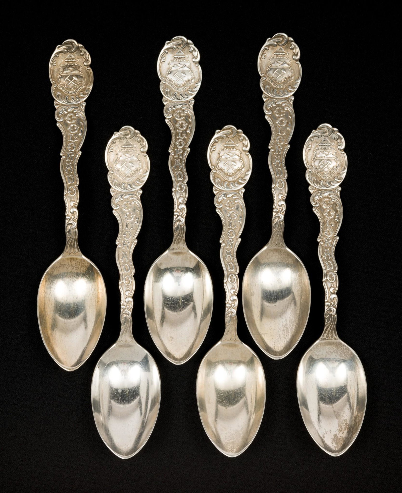 6 Wendell Mfg. Co. Sterling Colorado Sounvenir Spoons: Includes set of six Wendell sterling Colorado souvenir spoons monogrammed "D" to back and "Betz". 5-5/8" long. 4.2 total ozt. Light wear as expected with age. DP. IMPORTANT: Before bidding, please rea