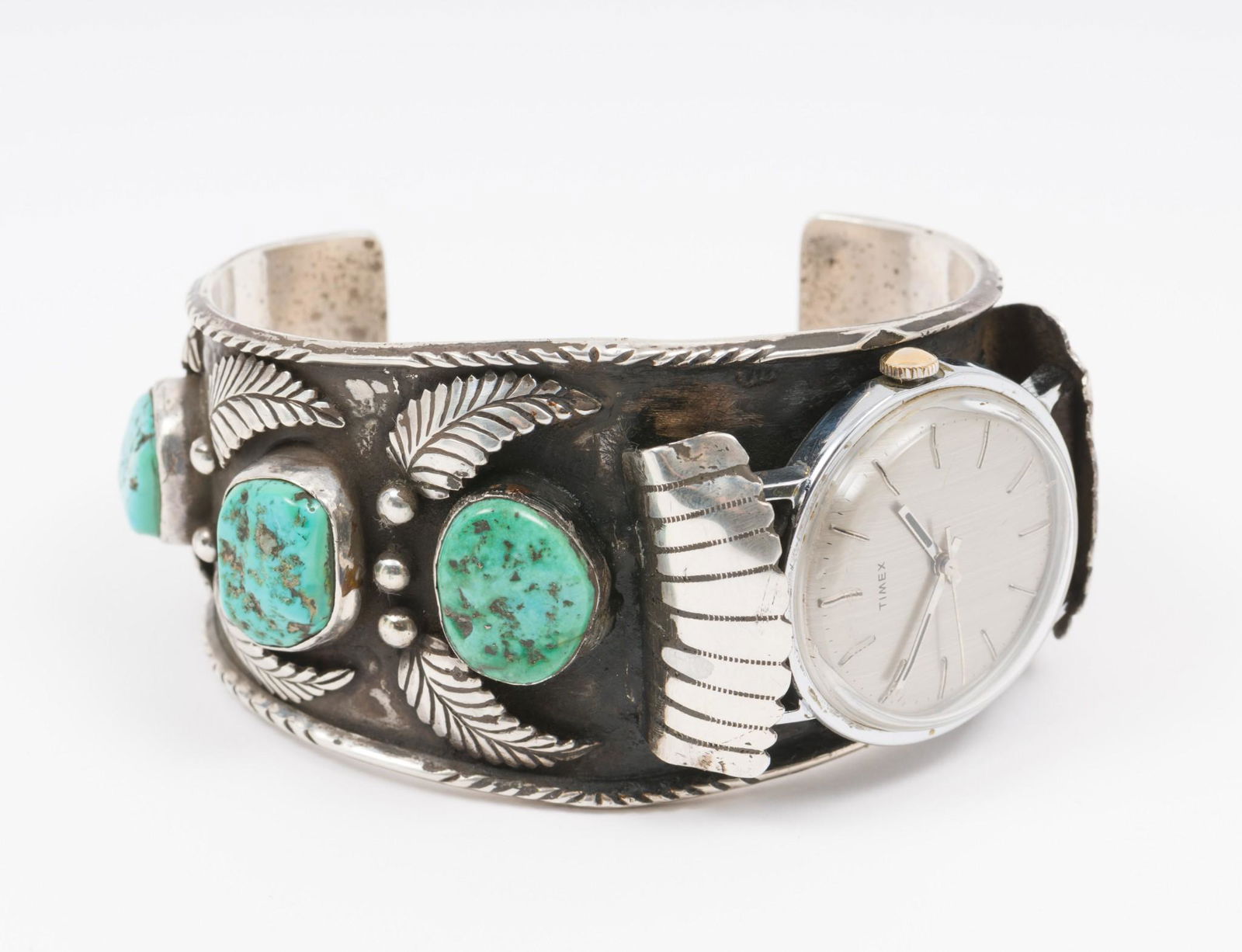 Navajo Sterling And Turquoise Watch Band Signed HRY: Signed "HRY". With Timex watch. 2-5/8" interior diameter. 1-1/4" wide. AJ/MH IMPORTANT: Before bidding, please read the terms and conditions. When you registered for the auction you agreed to the