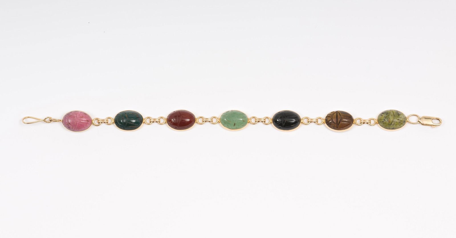 14k Gold Scarab Necklace: Marked 14k. Scarabs include serpentine, tiger's eye, onyx, nephrite, carnelian, bloodstone, and rhodochrosite. 7" long by 1/2" wide. AJ/MH/EK. IMPORTANT: Before bidding, please read the terms and