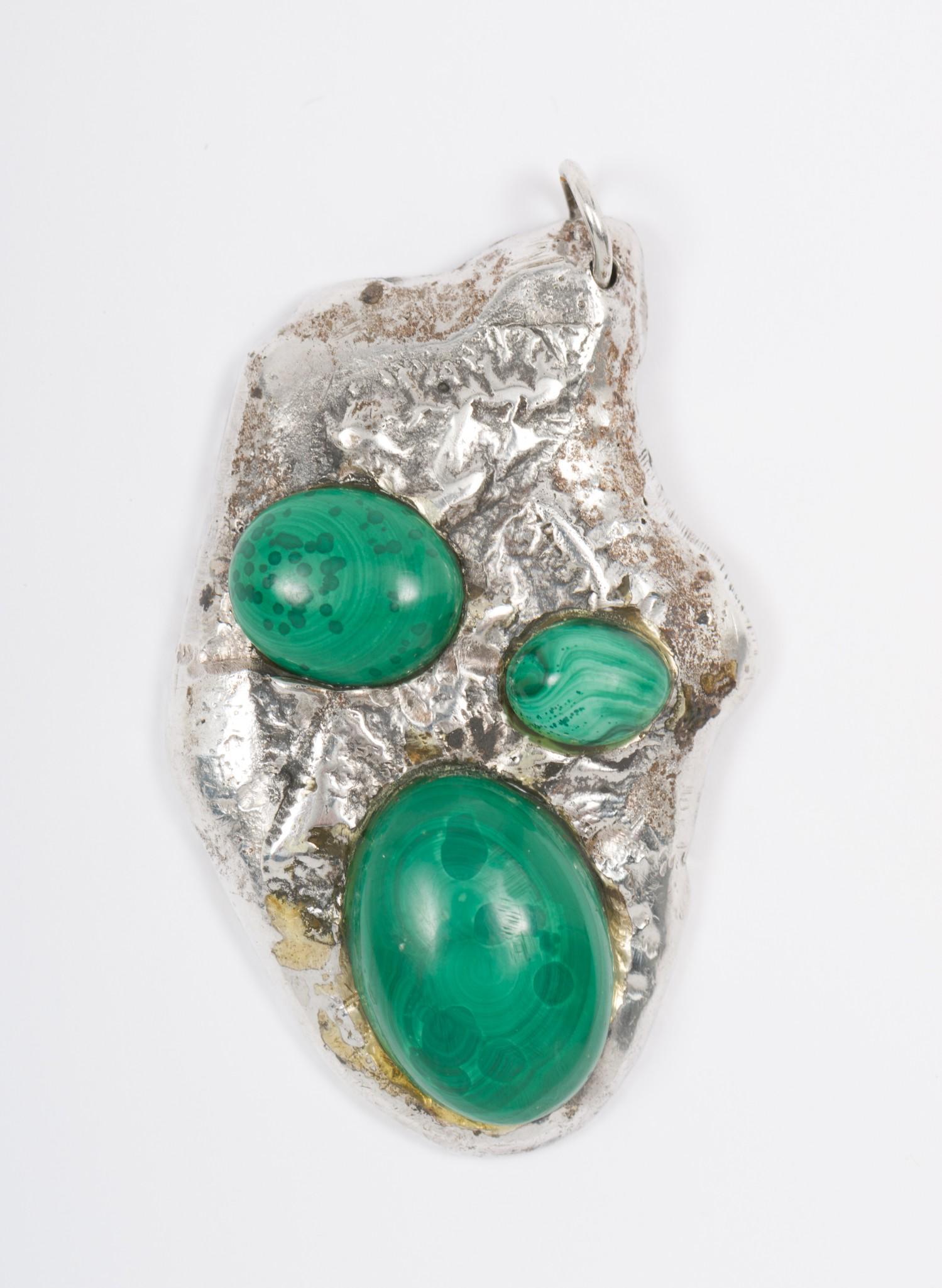 Handmade Sterling And Malachite Pendant: Unmarked. 1-3/4" long. AJ/MH IMPORTANT: Before bidding, please read the terms and conditions. When you registered for the auction you agreed to these terms and will be required to comply with the