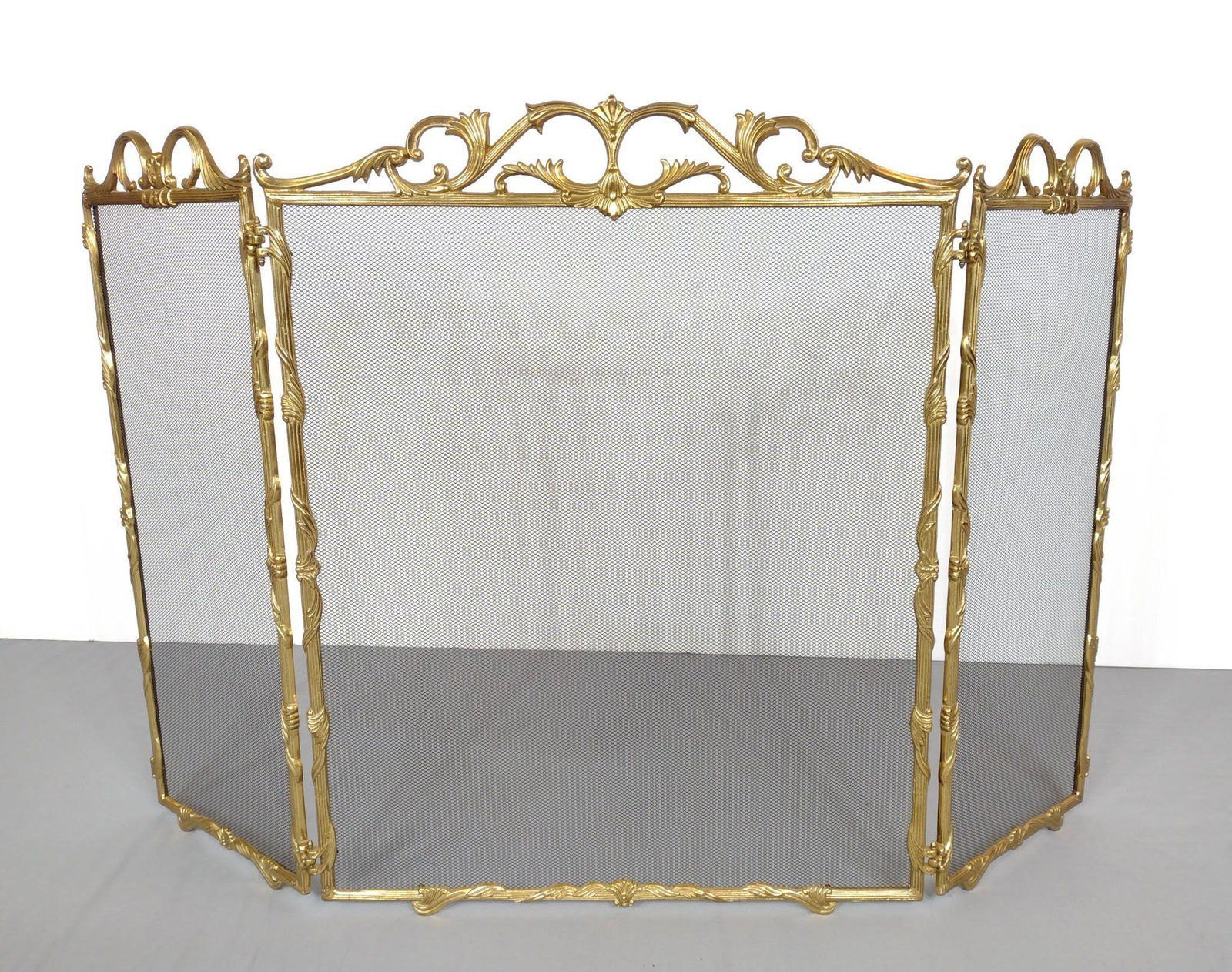 Brass Fire Screen: 55" wide X 1/2" deep X 34" high. MG. IMPORTANT: Before bidding, please read the terms and conditions. When you registered for the auction you agreed to these terms and will be required to comply with 