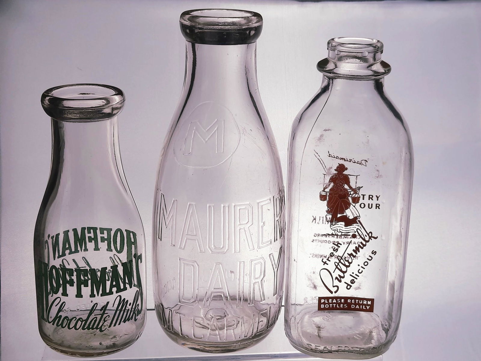 3 Milk Bottles incl Maurer's Dairy Mt. Carmel, PA: Also includes Chambersburg Dairy Products Co and Hoffman's Chocolate Milk. 7-1/2" to 9-1/2" high. LR IMPORTANT: Before bidding, please read the terms and conditions. When you registered for the auctio