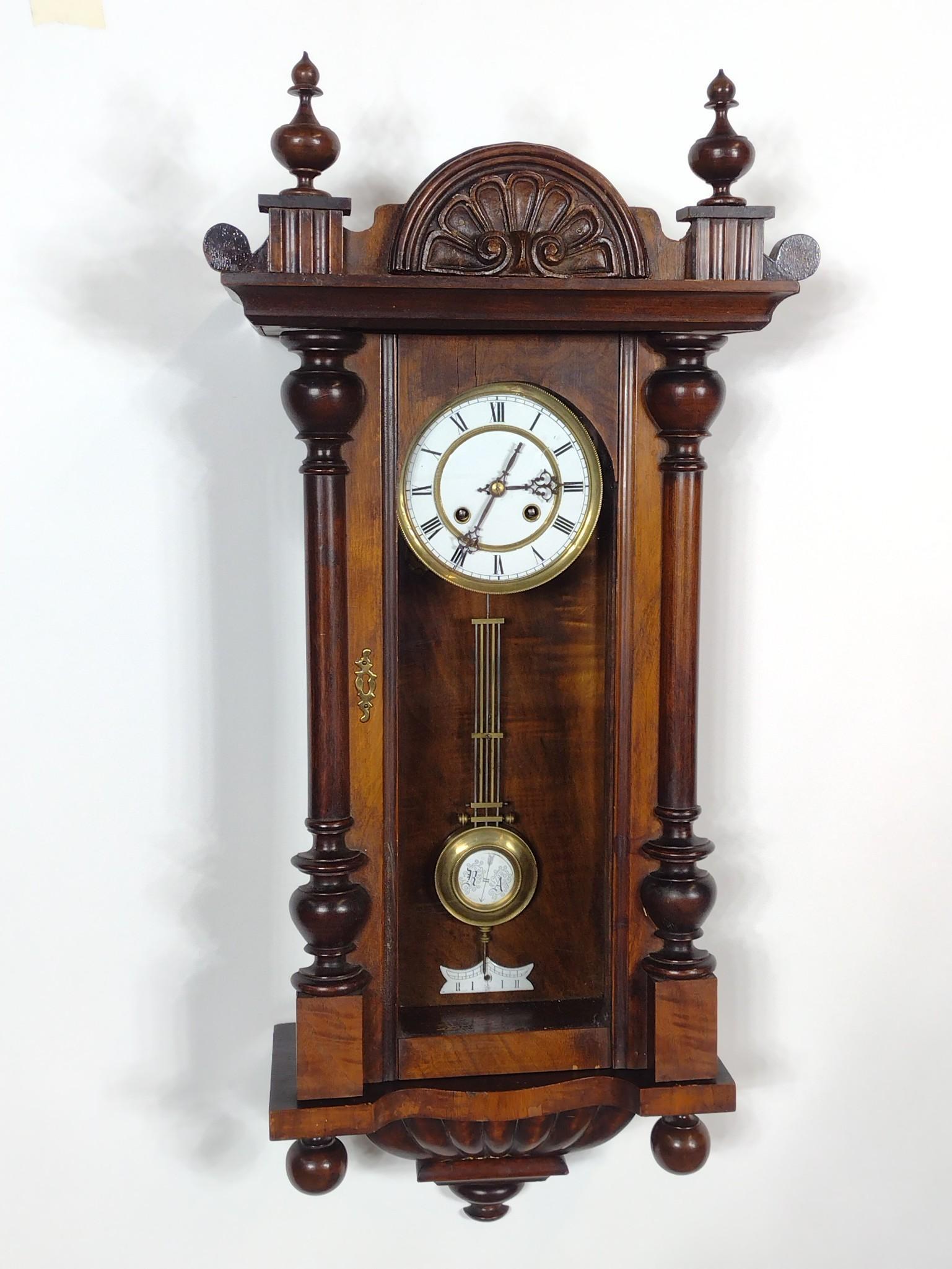 Wall Clock: Working. 12-3/4" wide X 5-3/4" deep X 34" high. No manufactures name found. MG. IMPORTANT: Before bidding, please read the terms and conditions. When you registered for the auction you agreed to these