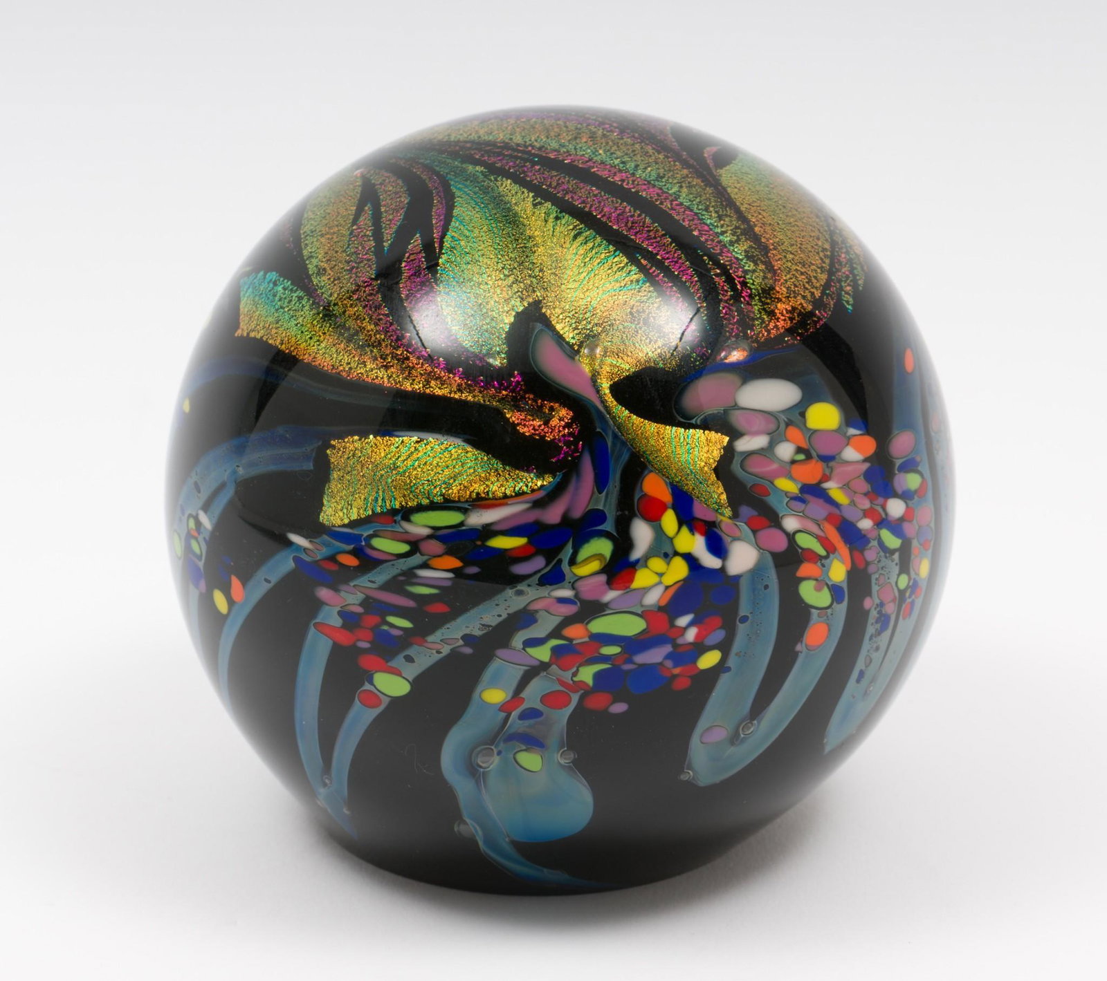 Rollin Karg (b. 1944, American, Kansas): DESCRIPTION: Polychrome glass sphere. Rollin Karg (b. 1944, American, Kansas). Blown glass. Signed around lower edge and dated 2009. Rollin Karg started life as an industrial engineer, photographer, p