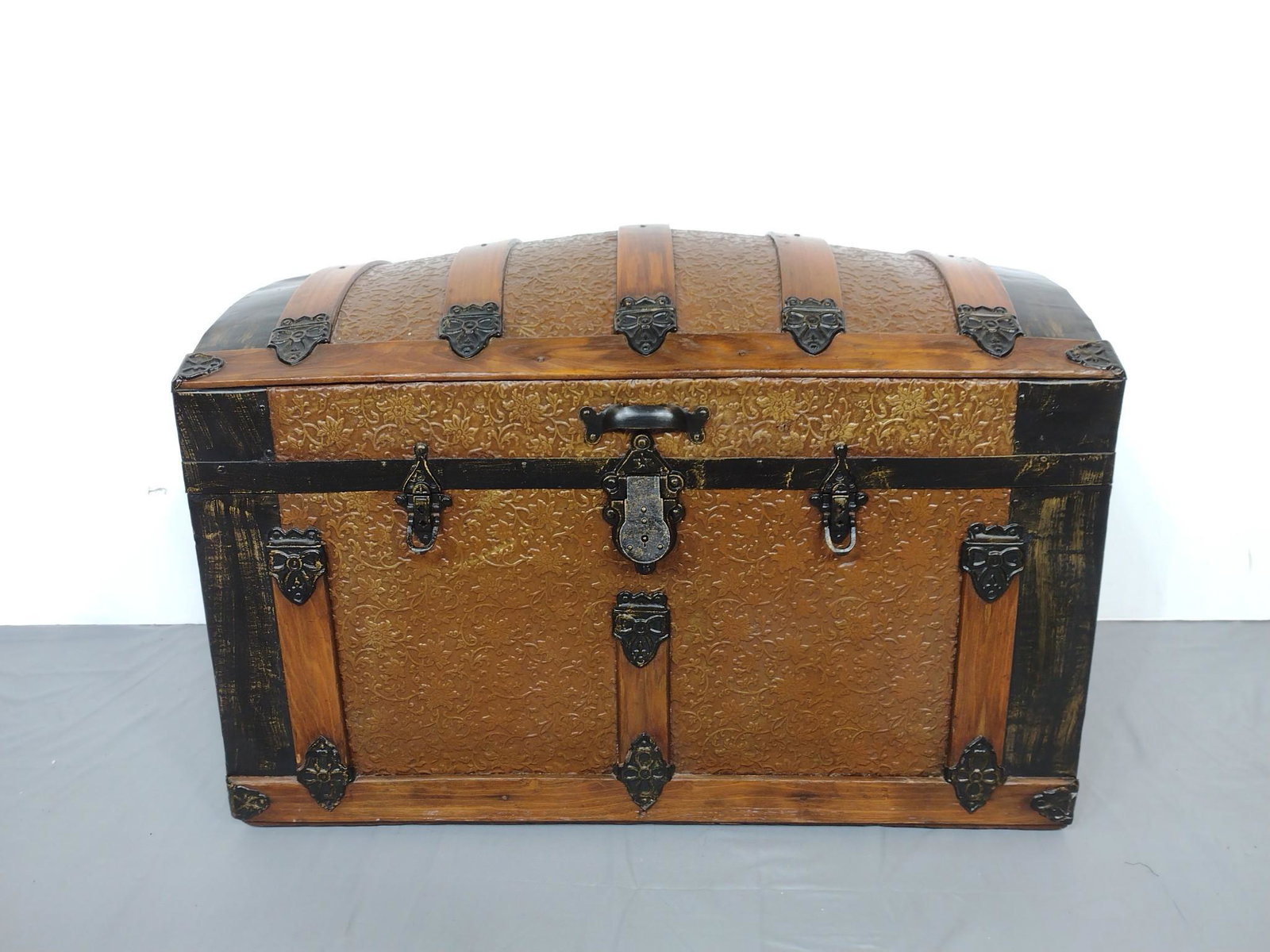Steamer Trunk: 32-1/4" wide X 18-1/4" deep X 19-1/4" high. One handle is broken. MG. IMPORTANT: Before bidding, please read the terms and conditions. When you registered for the auction you agreed to these terms and
