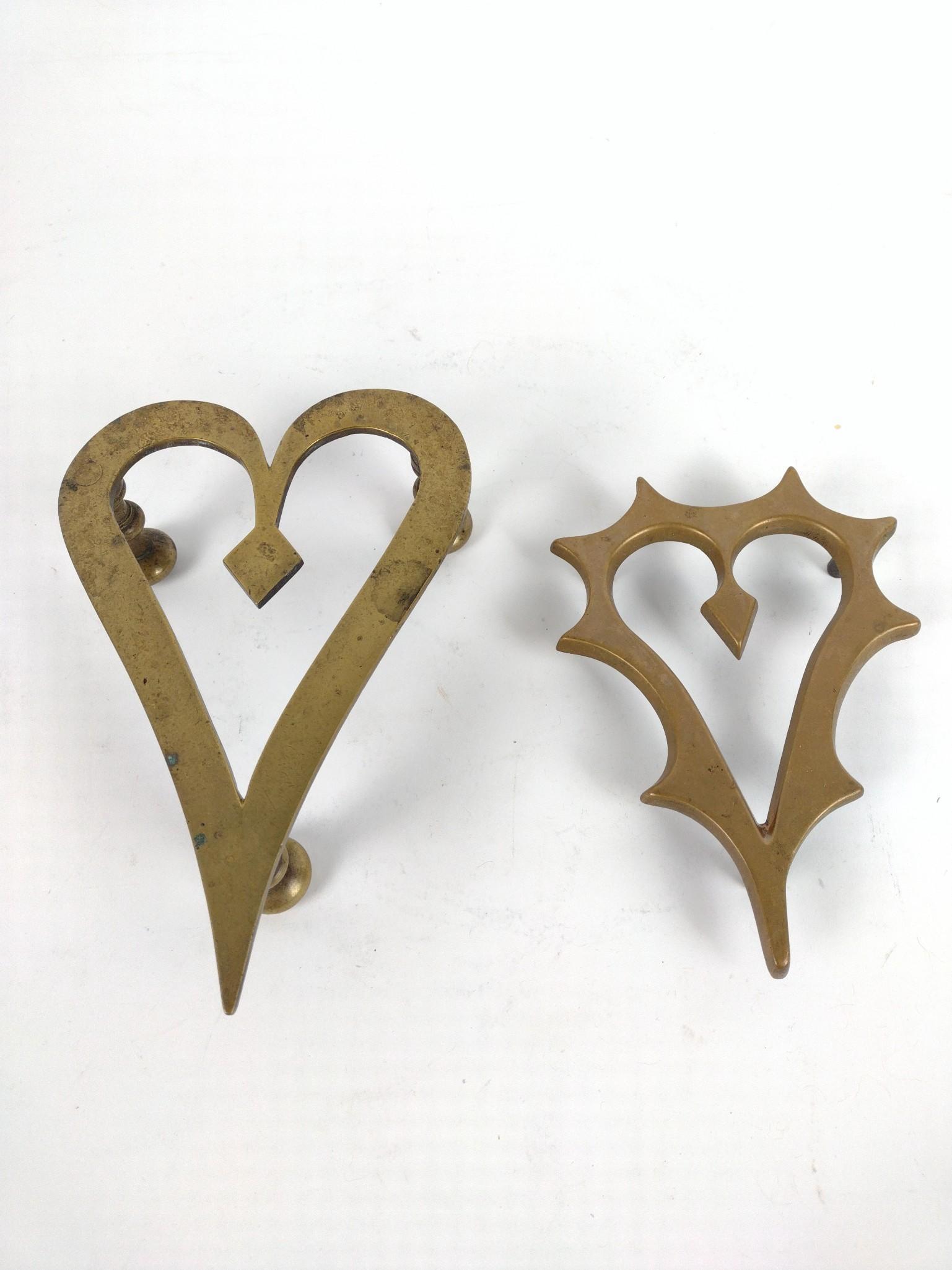 2 Antique Brass Trivets Heart Shaped: 1" to 2" high x 4" to 5" wide x 6" to 7" deep. JB IMPORTANT: Before bidding, please read the terms and conditions. When you registered for the auction you agreed to these terms and will be required to
