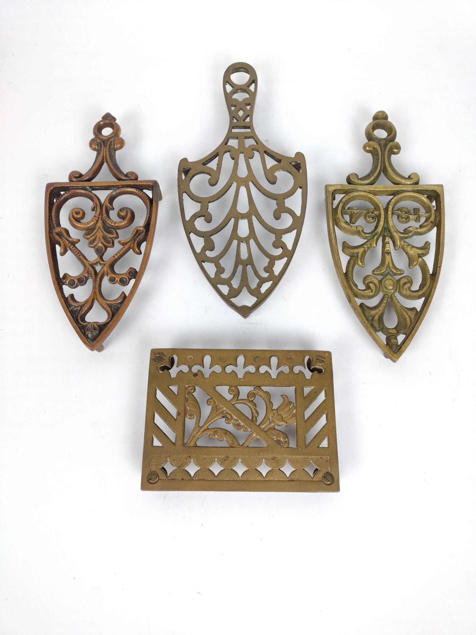 4 Antique Brass Trivets: Includes 1 square. 1" high x 3-1/2 x 5-1/2" wide x 4" to 9" deep. JB IMPORTANT: Before bidding, please read the terms and conditions. When you registered for the auction you agreed to these terms and