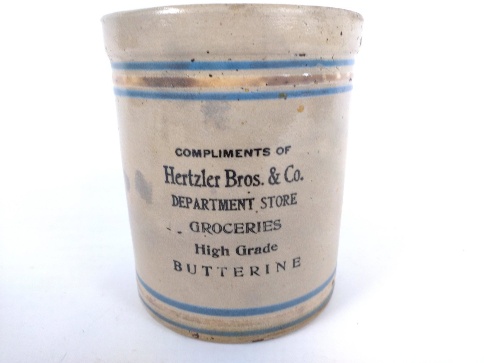 Hertzler Bros. & Co. Advertising Crock: Butterine. Braddock, PA. 5-3/4" diameter x 7" high. JB IMPORTANT: Before bidding, please read the terms and conditions. When you registered for the auction you agreed to these terms and will be requir