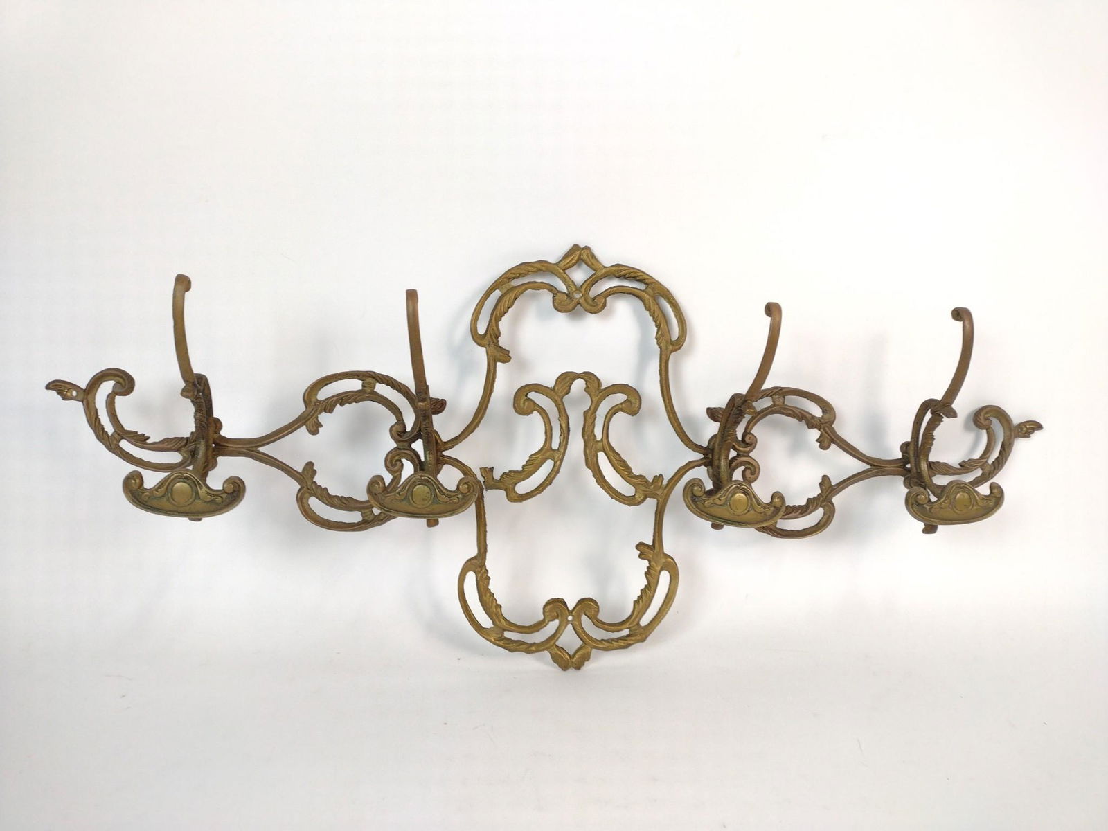 Vintage Brass hat and Coat Hanger: Wall Mount. 29-1/2" wide x 12-1/2" high. JB IMPORTANT: Before bidding, please read the terms and conditions. When you registered for the auction you agreed to these terms and will be required to compl