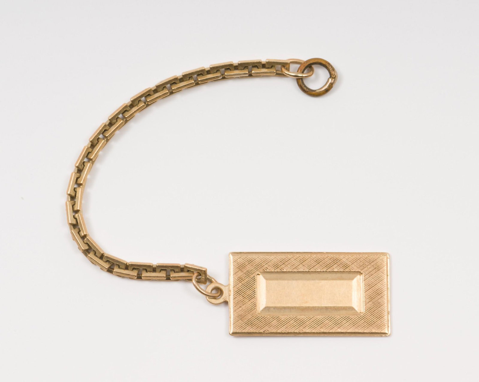 14k Charm on Chain: Charm marked 14K. Chain tests 14K. Charm 7/8" high by 1/2" wide. Total length 3-3/4". 3.1 dwt. AJ/MH. IMPORTANT: Before bidding, please read the terms and conditions. When you registered for the