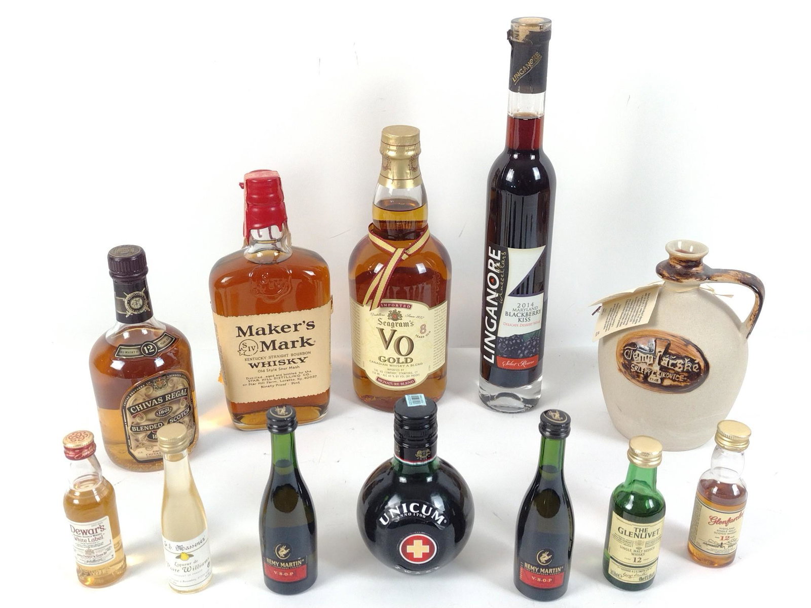 12 Bottle Of Estate Alcohol Incl Maker's Mark: This lot cannot be shipped. All sealed and unopened. Also includes Seagrams VO Gold, Chivas Regal, Unicum, Linganore wine, Templarske, Remy Martin, Dewars, The Glenlivet. MG. IMPORTANT: Before bidding