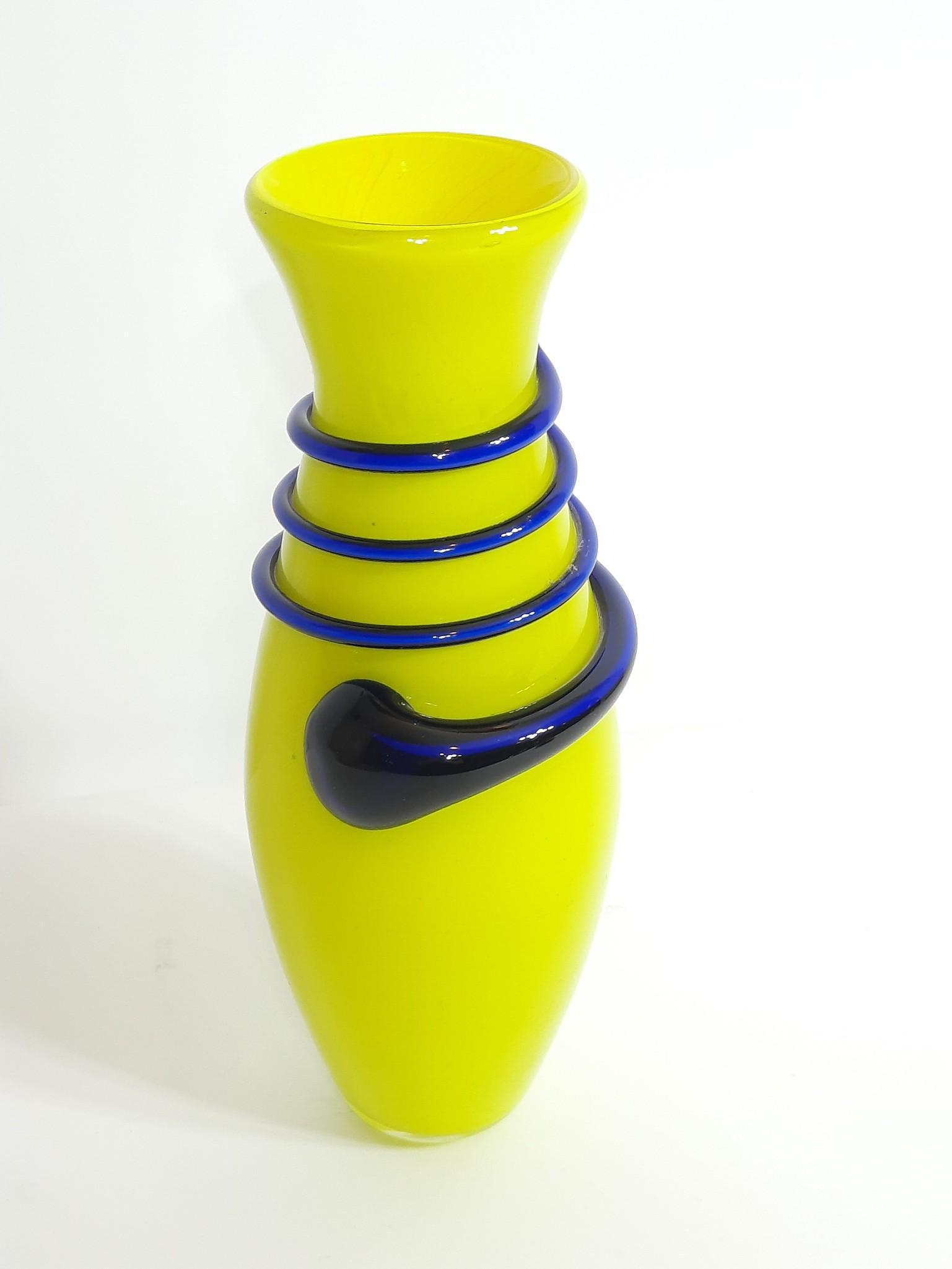 Yellow and Blue Art Glass Vase: Unsigned. 4" diameter x 11-1/2" high. LR IMPORTANT: Before bidding, please read the terms and conditions. When you registered for the auction you agreed to these terms and will be required to comply w