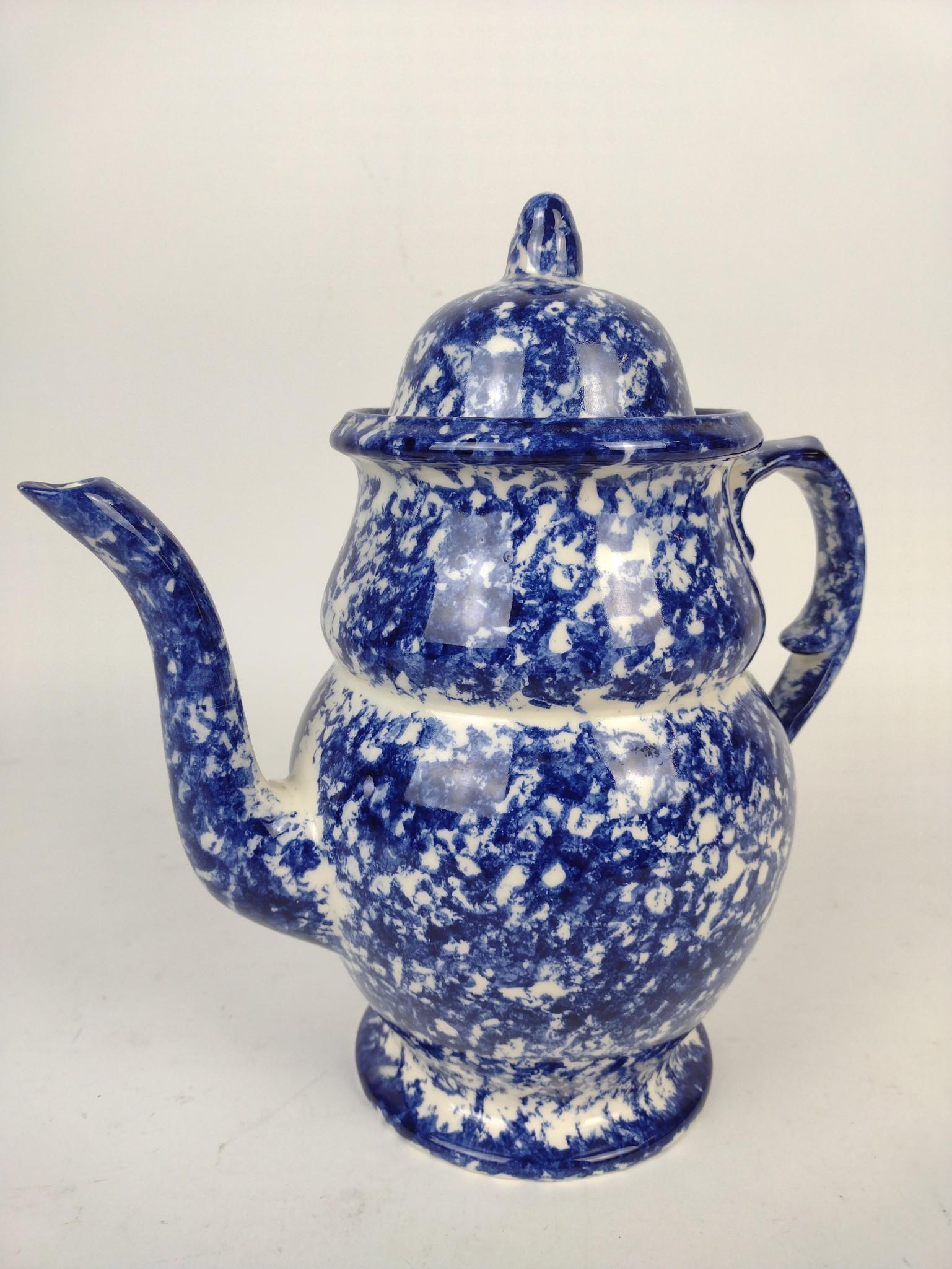 Spongeware Coffee Pot: 10" wide X 10-1/2" high. MG. IMPORTANT: Before bidding, please read the terms and conditions. When you registered for the auction you agreed to these terms and will be required to comply with them.