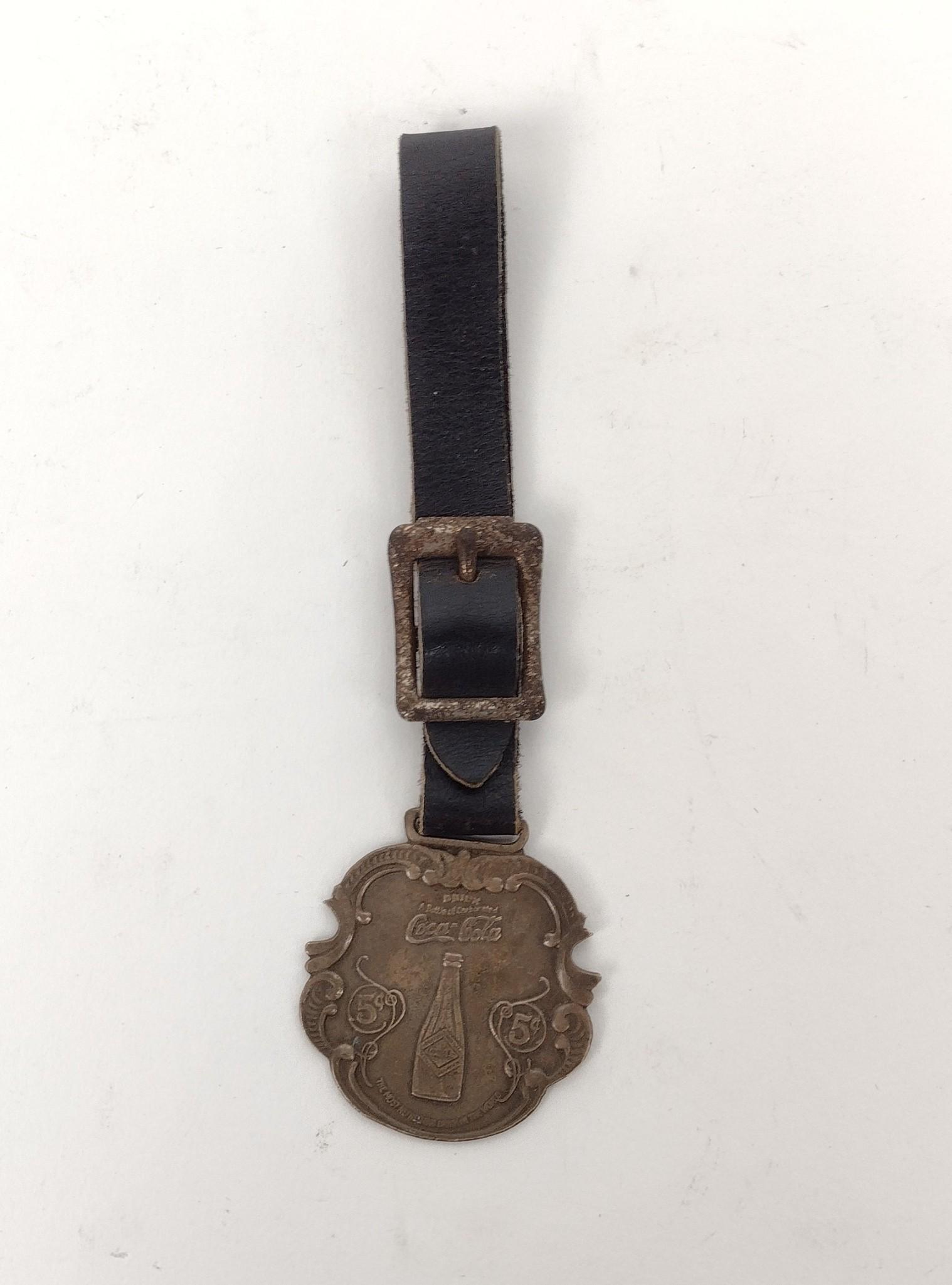 Sterling Coca-Cola Fob: 1-1/2" wide X 5-1/4" long. MEG IMPORTANT: Before bidding, please read the terms and conditions. When you registered for the auction you agreed to these terms and will be required to comply with them.