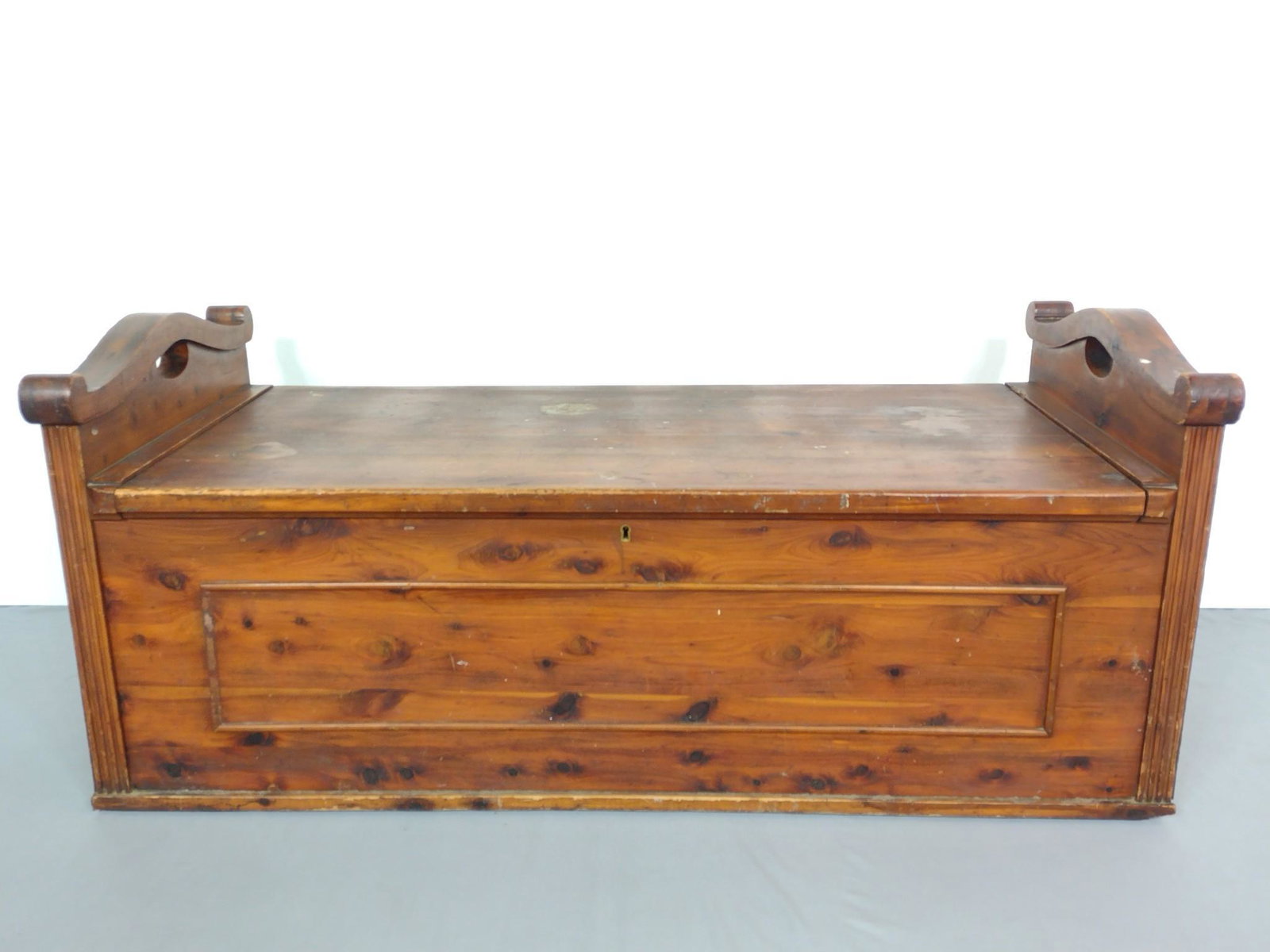West Branch Cedar Chest: 49-3/4" wide X 22-1/4" deep X 22" high. Has scratches and some areas of finish loss. MG. IMPORTANT: Before bidding, please read the terms and conditions. When you registered for the auction you agreed