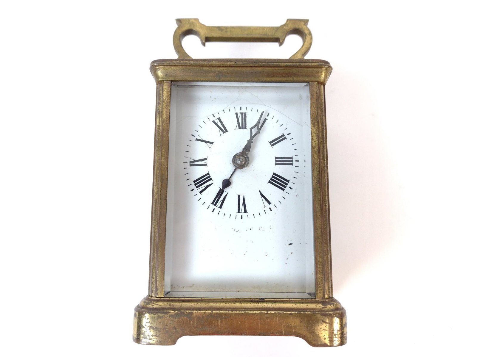 Carriage Clock: Working. 3-1/4" wide x 3" deep x 6-1/2" high. Cracks and discoloration to face. Loss to glass on back. Finish loss throughout. JB IMPORTANT: Before bidding, please read the terms and conditions. When 