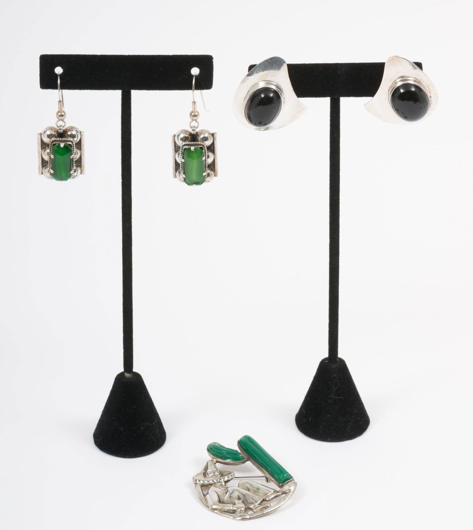 2 Pairs Of Mexican Sterling Earrings And 1 Brooch: All stamped Mexico. Onyx earrings 1-1/4" long. Malachite earrings 2" long. Brooch 2" long. AJ/MH IMPORTANT: Before bidding, please read the terms and conditions. When you registered for the auction yo