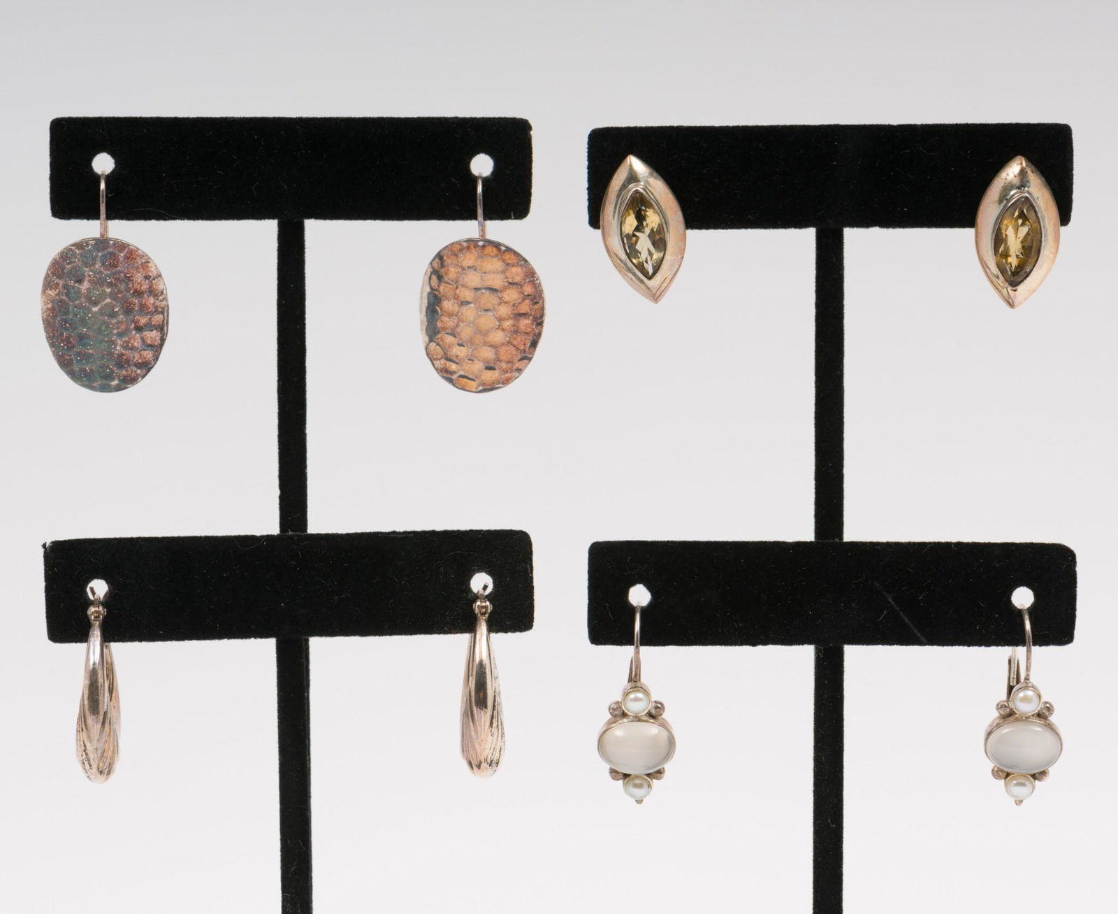 4 Pairs Of Sterling Earrings Incl. Moonstone: 3/4" to 1-1/4" long. All stamped 925. AJ/MH IMPORTANT: Before bidding, please read the terms and conditions. When you registered for the auction you agreed to these terms and will be required to compl