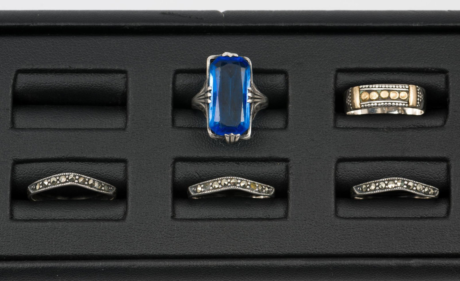 5 Sterling Rings: Including marcasite bands and blue glass. Sizes 3.5 to 8. EK/ML IMPORTANT: Before bidding, please read the terms and conditions. When you registered for the auction you agreed to these terms and will 