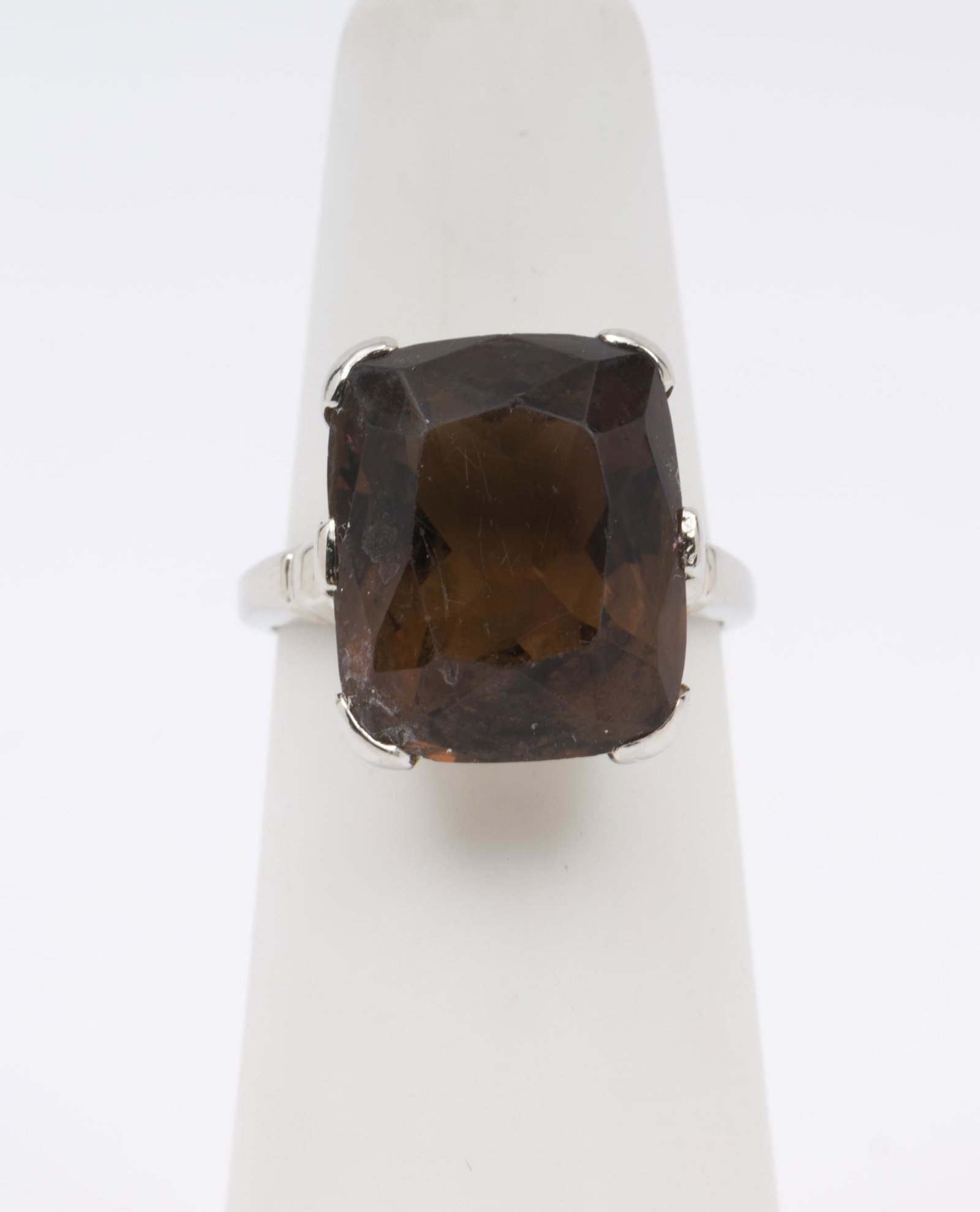 Antique 14K Gold and 8.75 Ct Smoky Quartz Ring: Antique white gold setting stamped 14k with rectangular cushion cut smoky quartz, approximately 8.75 carats (14.5mm x 11.9mm x 8.7mm). Size 4.5. 3 dwt. EK/ML IMPORTANT: Before bidding, please read the
