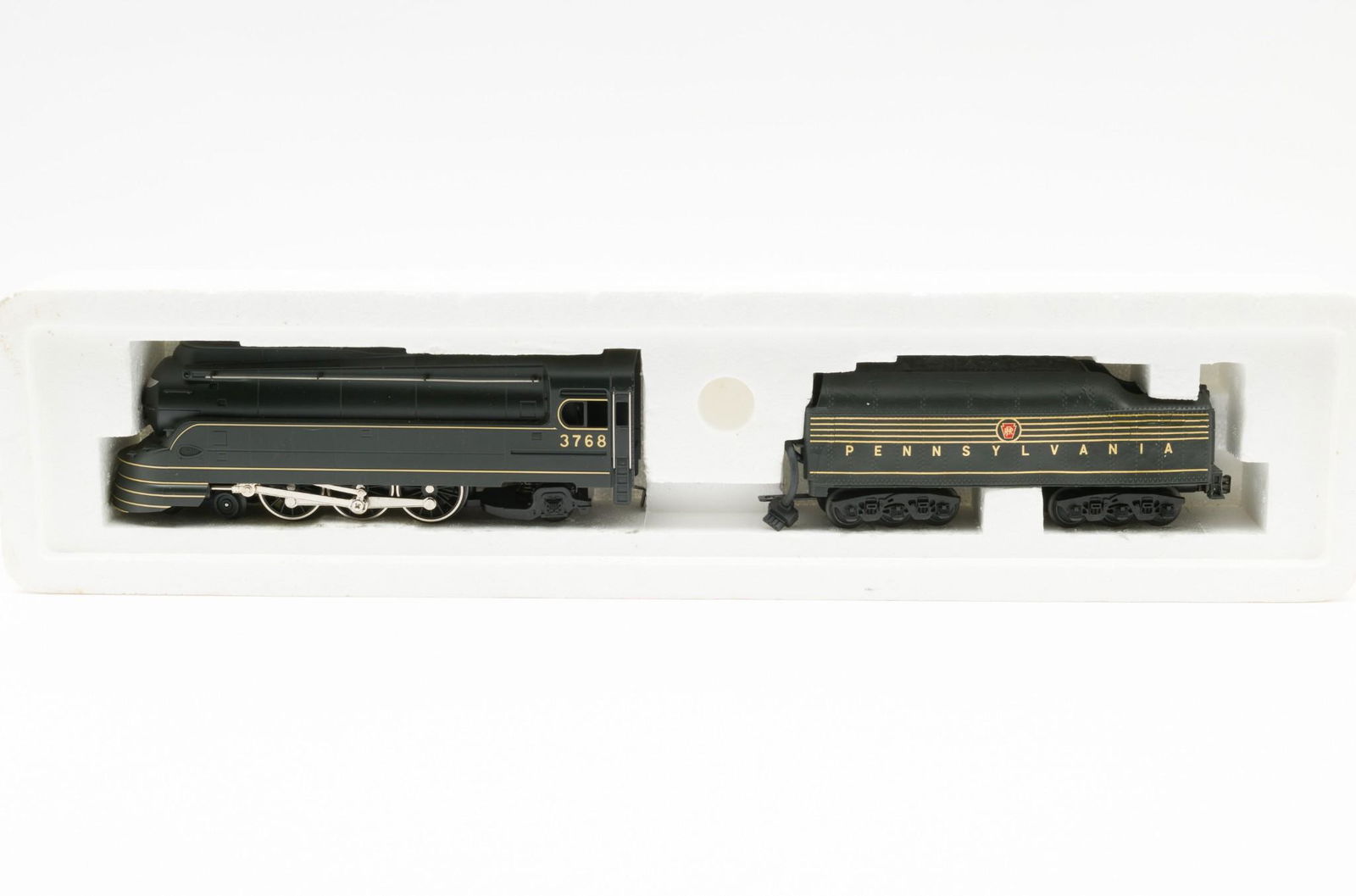 Rail King 4-6-2 Locomotive PA K-4S Torpedo: Rail King 4-6-2 Locomotive. Pennsylvania K-4S Torpedo. 3 Rail. Item number 30-118-1. Tender with cracks and separation due to suspected heat exposure. New in box. LR IMPORTANT: Before bidding, please