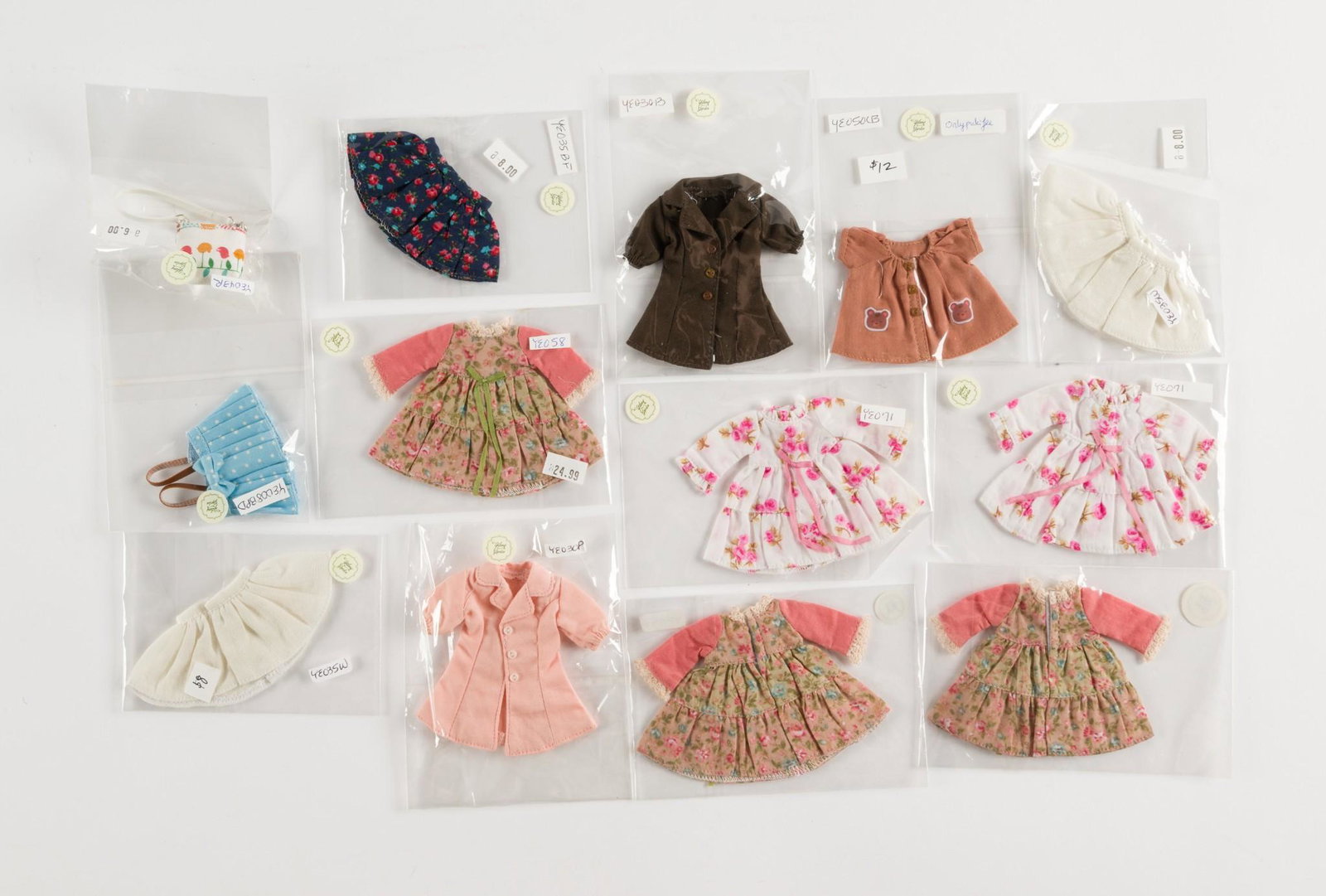 11 Ylang Garden Doll Clothes: Includes dresses, shirts and skirts. Various sizes and colors. AJ. IMPORTANT: Before bidding, please read the terms and conditions. When you registered for the auction you agreed to these terms and wi