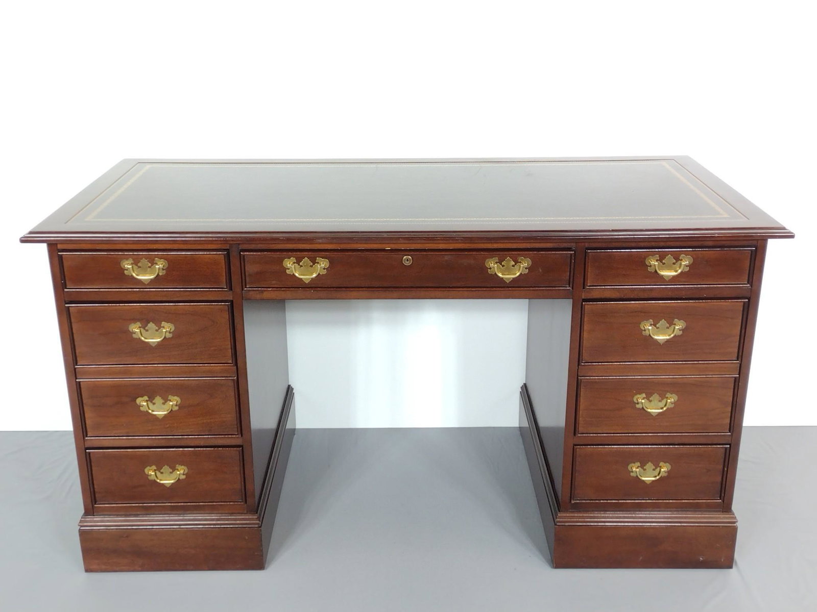 Sligh Furniture Co. Desk: 56" wide X 26" deep X 30" high. Has some light scratches. MG. IMPORTANT: Before bidding, please read the terms and conditions. When you registered for the auction you agreed to these terms and will be