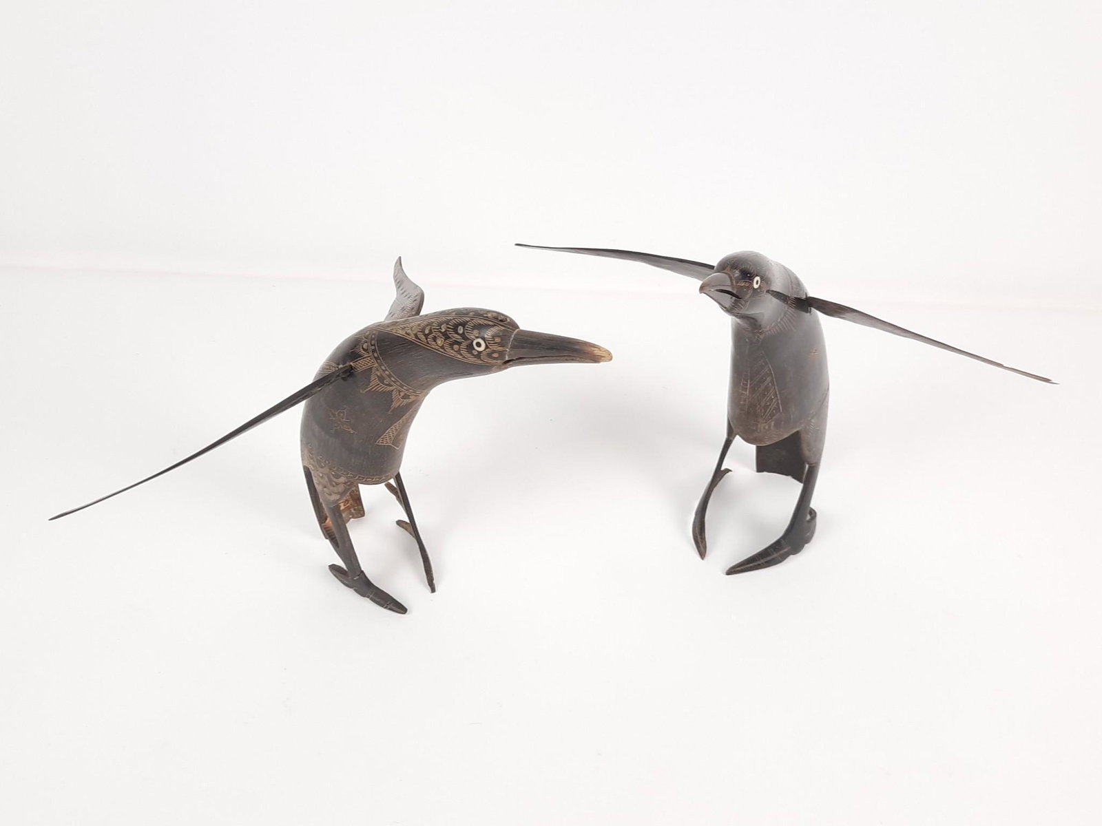 2 Horn Carved Birds: Each approximately 11" wide x 9" deep x 9" high. One with repaired foot. LR Provenance: From the estate of Mary Trost who last resided in the multi generational family home located in Clarks Valley, D